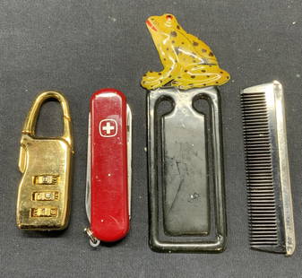 Lot 4 Combination Lock, Swiss Knife, More: Lot of 4 pieces. Gold tone combination lock. As is, locked. Measures approx. 2.25 inches long. Swiss pocket knife with Banana Republic logo. Measures approx. 2.5 inches long. Black comb with silver to