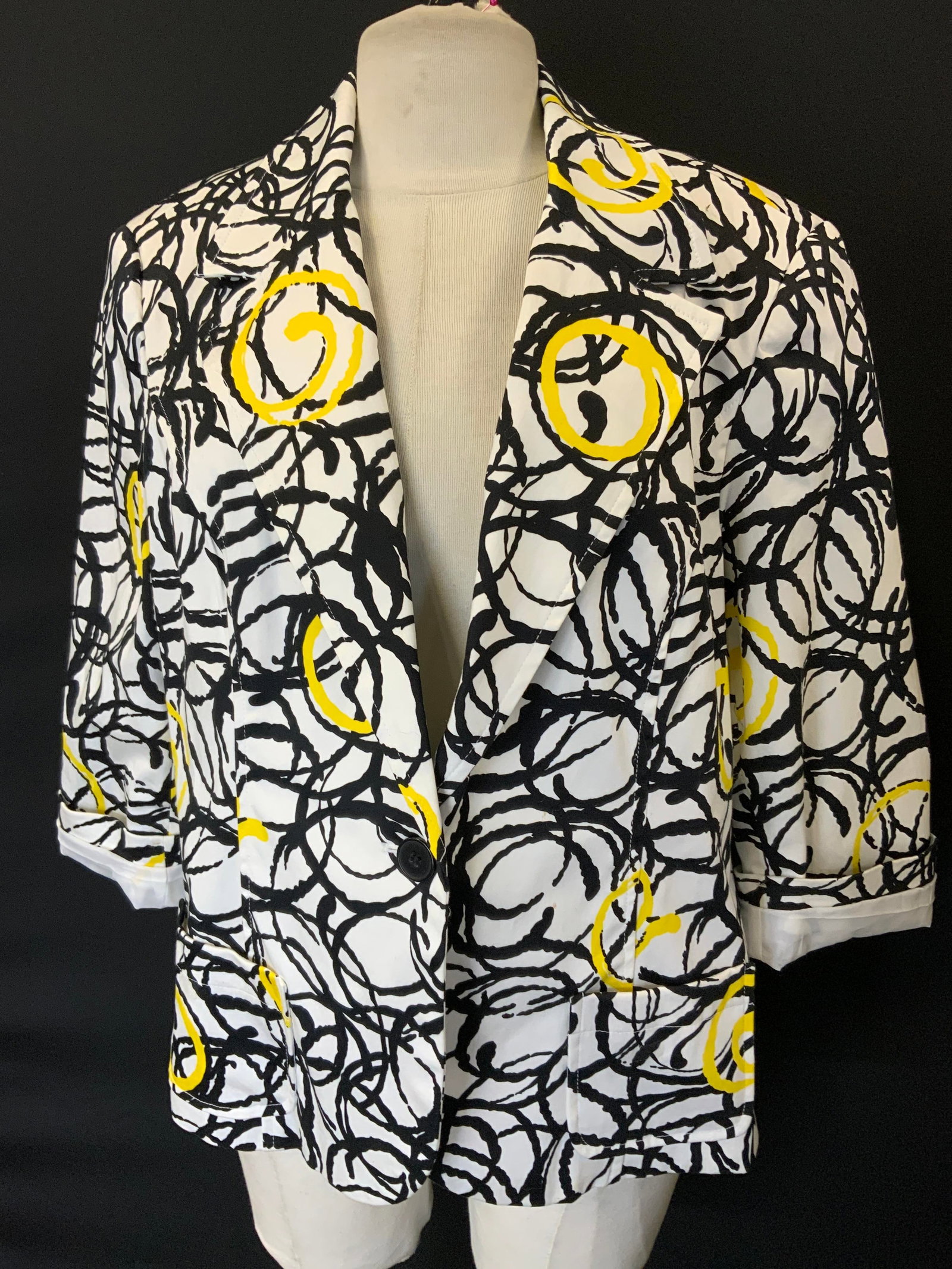 Harve Benard Cotton Fashion Jacket: Harve Benard Size XL cotton jacket. White with black and yellow circular design. Sewn in shoulder pads. Hand pocket and singular button. 25 in. Long. Rolled up cuffs. Evening jacket, Cocktail jacket, 