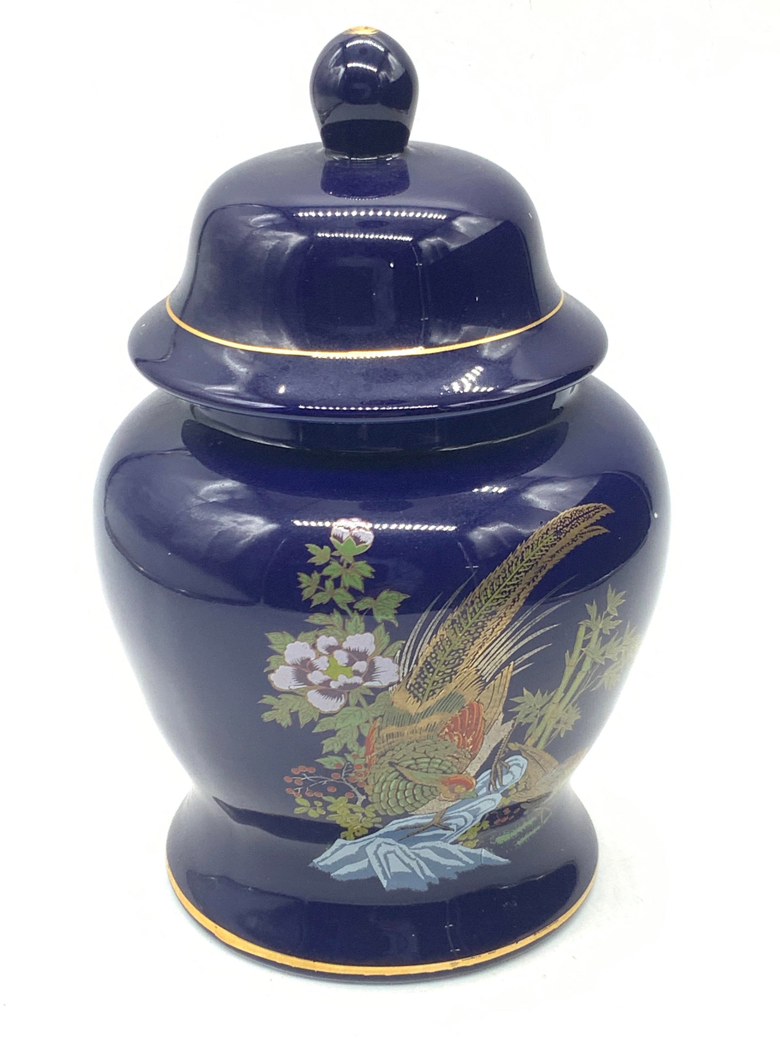 Stamped Asian Style Hand Painted Porcelain Urn: Hand painted Asian style porcelain urn with exterior in a cobalt blue with hand painted motifs of pheasants with gilt bands on body, stamped on underside in Chinese characters. Approx 7.5 inches tall 