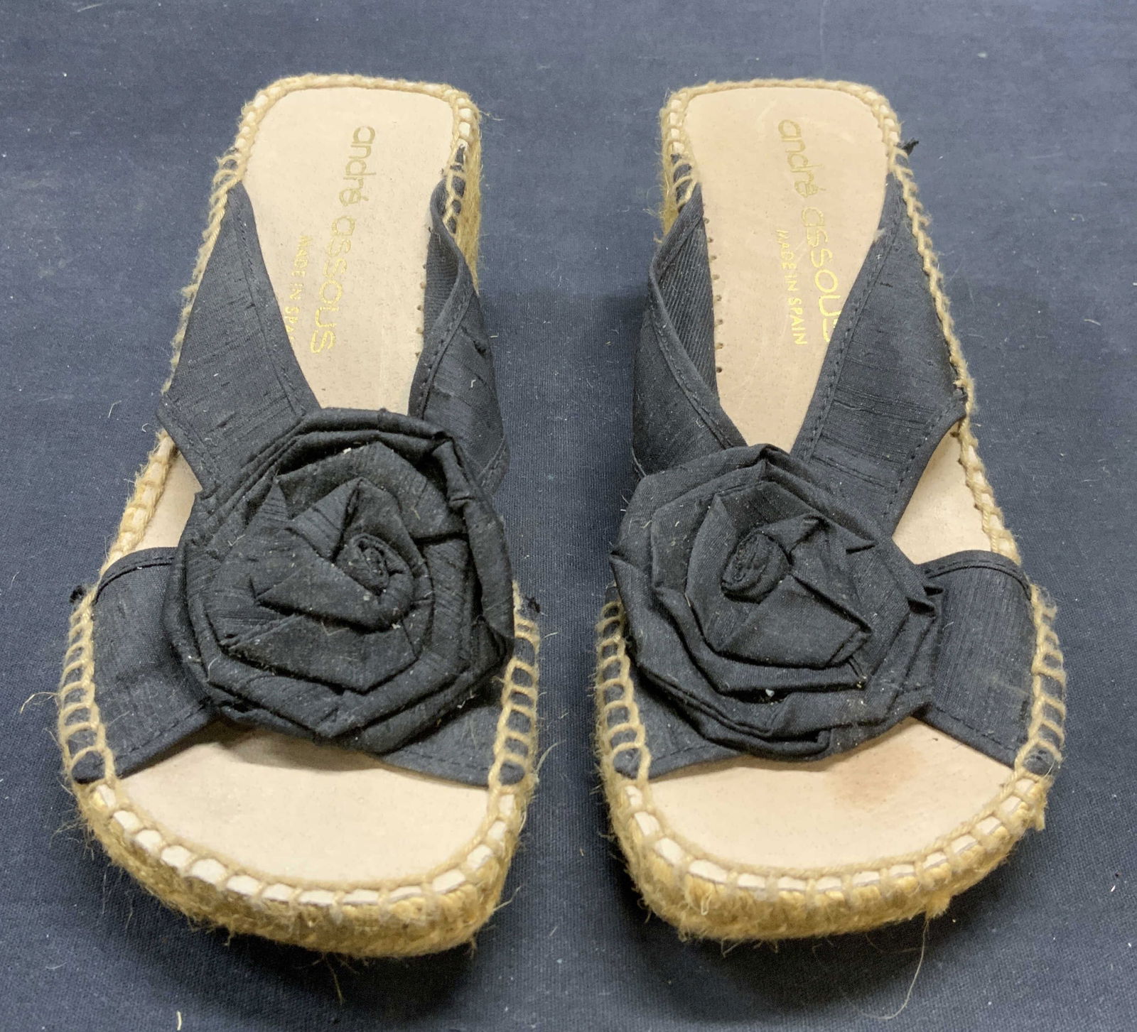 Andre Assous Black Woven Wedge Heels, Spain: Andre Assous black and tan woven wedge heels with floral decoration. Made in Spain. Size 7. Some wear to material and soles observed. Property of Manhattan Estate DuPont Heir. Andre Assous, Andre Asso