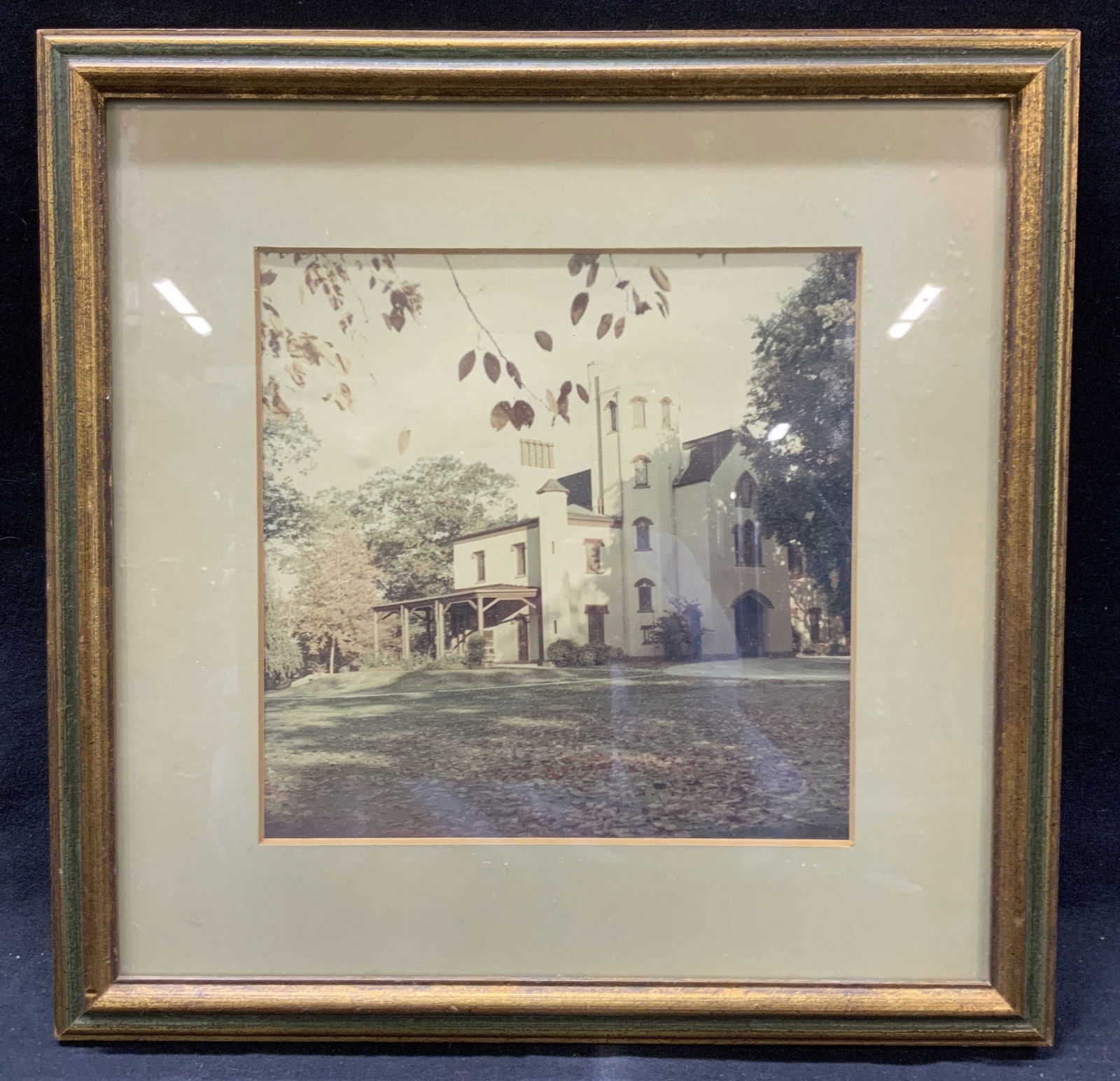 Framed Sepia Toned House Photograph: Framed photograph of a house in a sepia tone. Framed in a gold leafed wooden frame with tan toned mat board approx 13 x 13 inches window measures 7.5 x 7.5 inches. Moderate wearing to frame. Framed ar