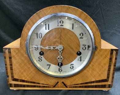 ENFIELD CLOCK CO Inlaid Wood Mantel Clock ENGLAND: Interior is inscribed ENFIELD CLOCK CO LTD MADE IN ENGLAND. Clock has wooden shell with inlaid detail. Clock face has silver toned metal area with black numbers, silver toned hands. Clock face window