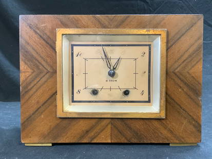 SETH THOMAS Vintage Wood Shell Mantel Clock: Clock face & interior read SETH THOMAS. Clock is vintage with beige toned wooden shell. Piece has tan toned clock face with black toned numbers & hands. Clock face window & backside opens. Piece has g