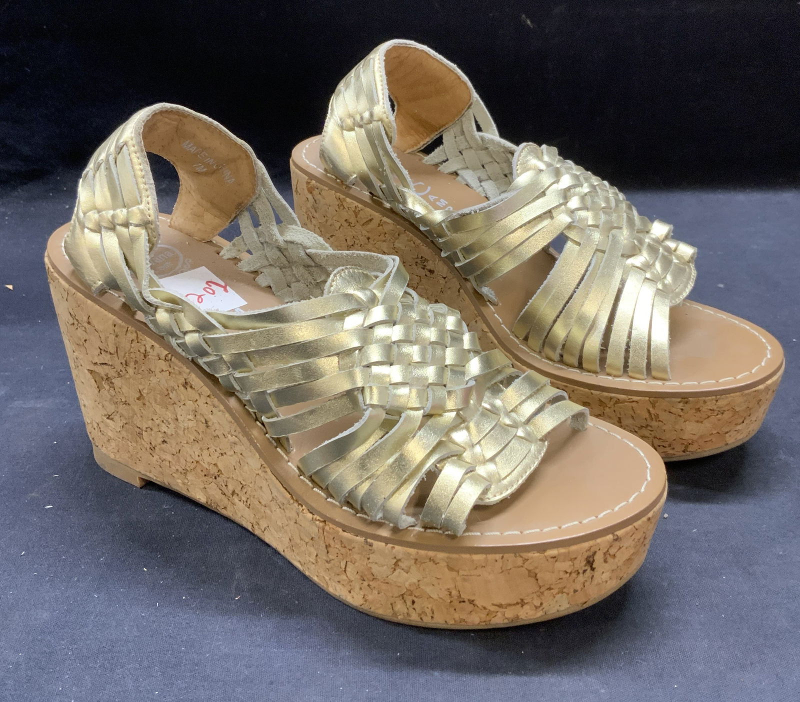 Jeffrey Campbell Gold Cork Wedge Heels: Jeffrey Campbell Havana Last gold tone wedges with cork heels. Size 7. Some wear to material consistent with exposure. Jeffrey Campbell, Jeffrey Campbell heels, Jeffrey Campbell wedges, ladies designe