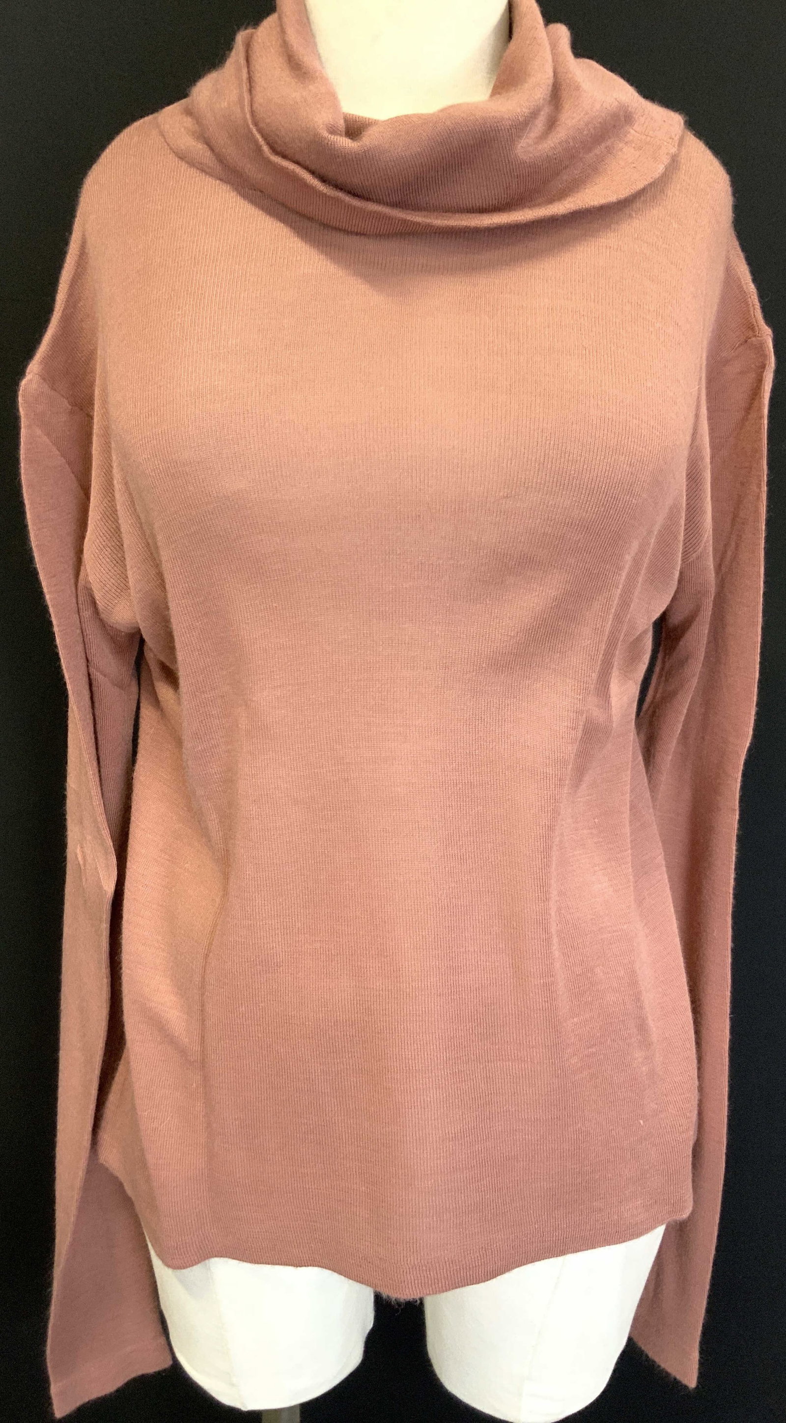 Fabric Blend Long Sleeve Turtle Neck Shirt: A salmon Pink toned long sleeve shirt with turtle neck. No size or material tag. Sleeves measures 22 inches from underarm inseam. Torso measures 22.5 inches and chest measures 20 inches across. Minor