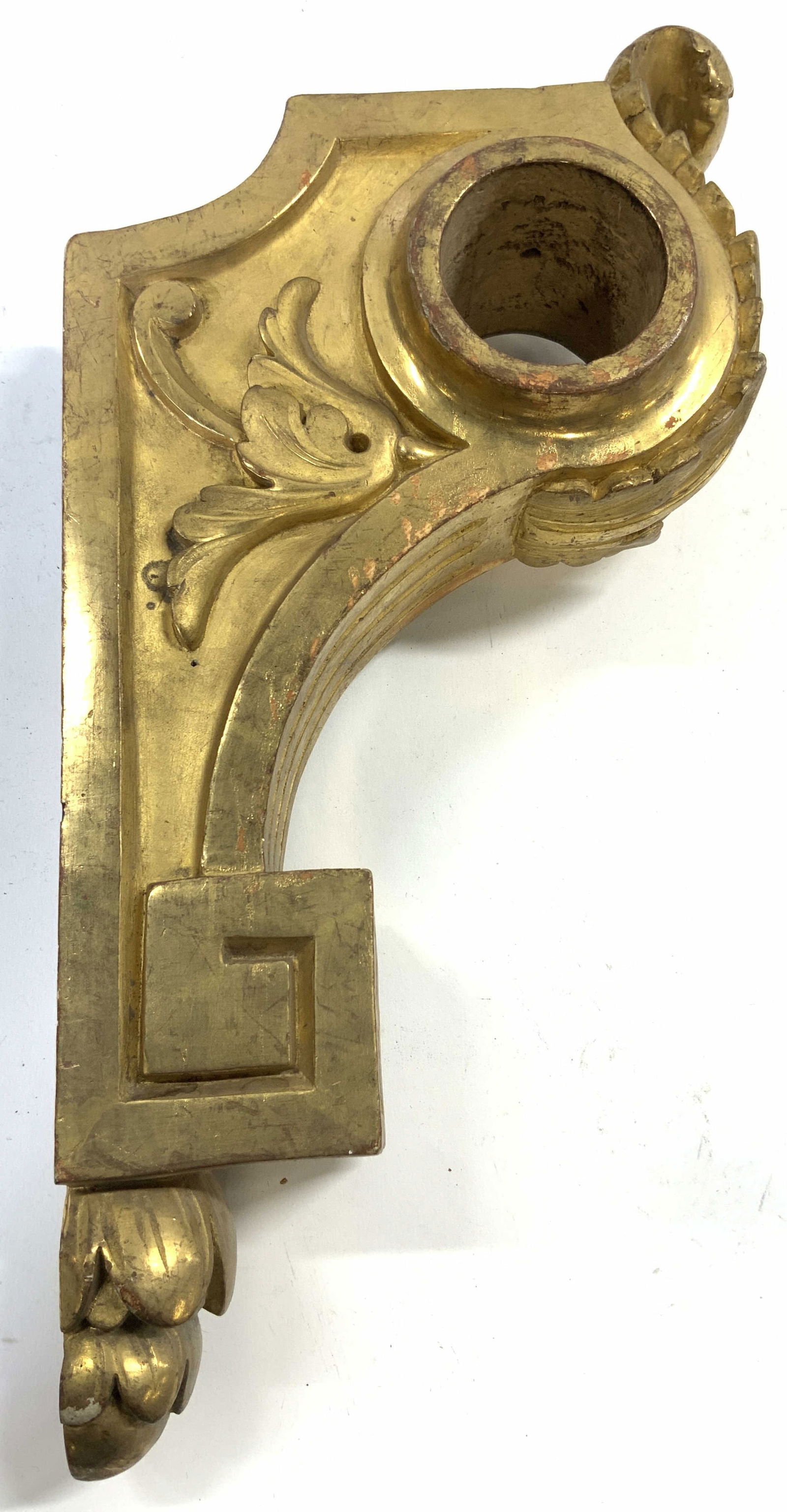 Vintage Ornate Gilt Wood Wall Mount Decor: Wall mount piece is vintage. Piece is gilt wood with leaf, floral, & scroll detail. Piece measures approximately 13 inches tall 6.75 inches deep 3 inches wide. Wall mount, wall mount decor, vintage wa