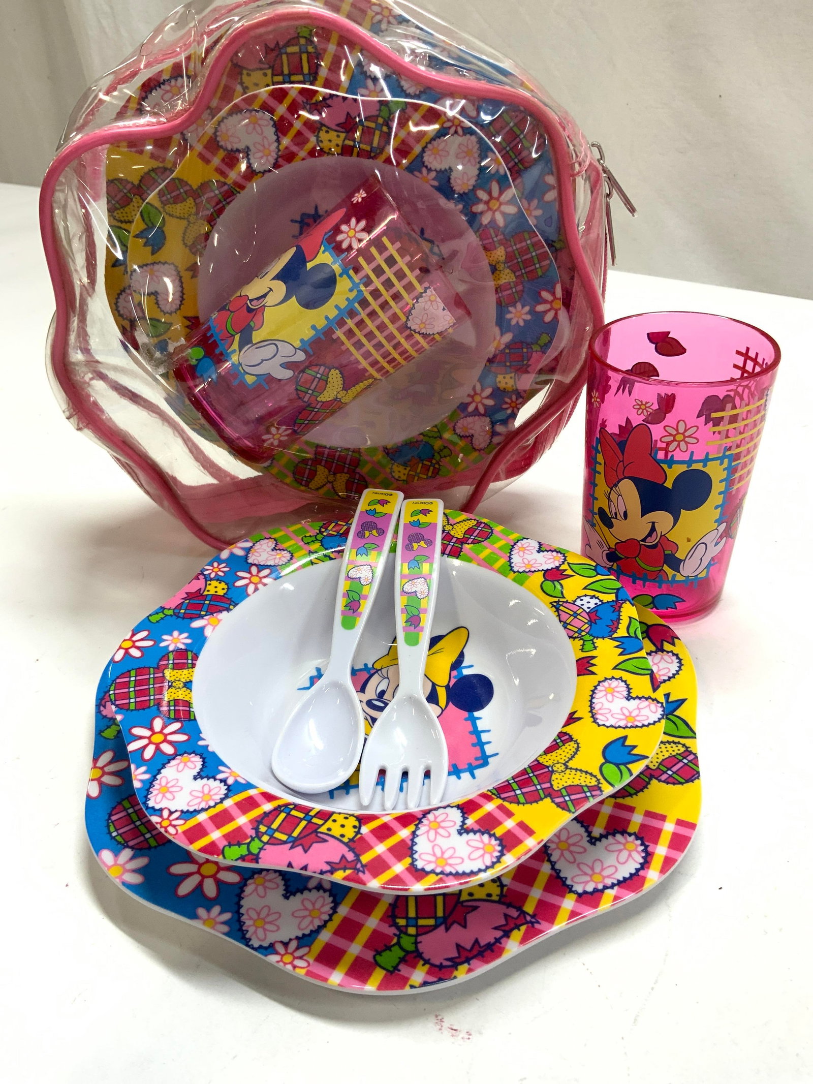 NIP 2 Sets Disney Minnie Mouse Melamine Tableware: 5 piece kit of Disneys Minnie Mouse melamine tableware. There are 2 sets in the original zippered package. Plate, Bowl, cup, spoon and fork. Plate measures 8.25 in. Bowl is 7 x 1.25 in. Childrens tabl