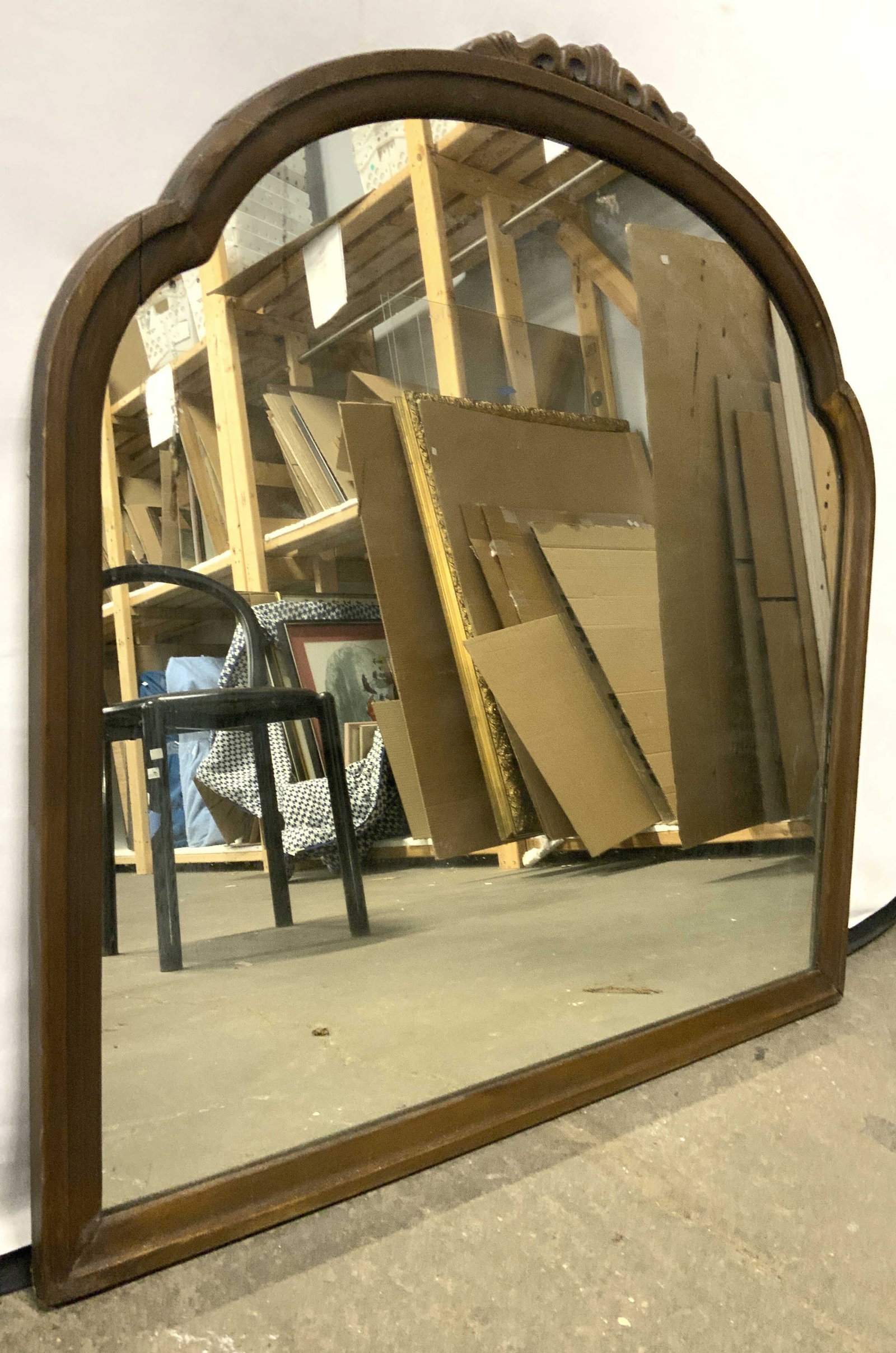 Vintage Carved Wood Frame Wall Mirror 30in: Mirror is vintage with brown toned carved wooden frame. Piece has arch shaped top. Top of piece has carved detail. Piece measures approximately 30 inches tall & wide. Mirror, wall mirror, wall decor, 