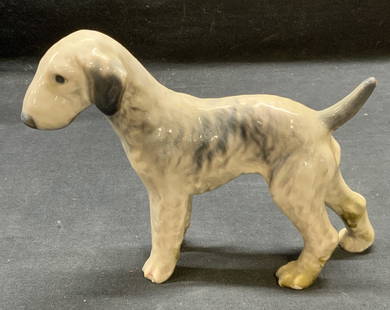 Dahl Jensen Porcelain Dog Figural, Denmark: Dahl Jensen DJ Copenhagen porcelain dog figurine in gray. Trademarked to underside. Made in Denmark. Measures approx. 7.5 x 2 x 5.75 inches. Some surface wear including scratching observed. Property o