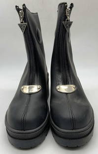 GUESS FOOTWEAR Black Heeled Zippered Boots: A pair of black heeled zippered Guess boots. Silver tone metal hardware to the obverse. Interior tag reads GUESS FOOTWEAR. Underside reads, MADE IN SPAIN, 38, 37. Shoes measure approx. 10L x 3.5W x 9.