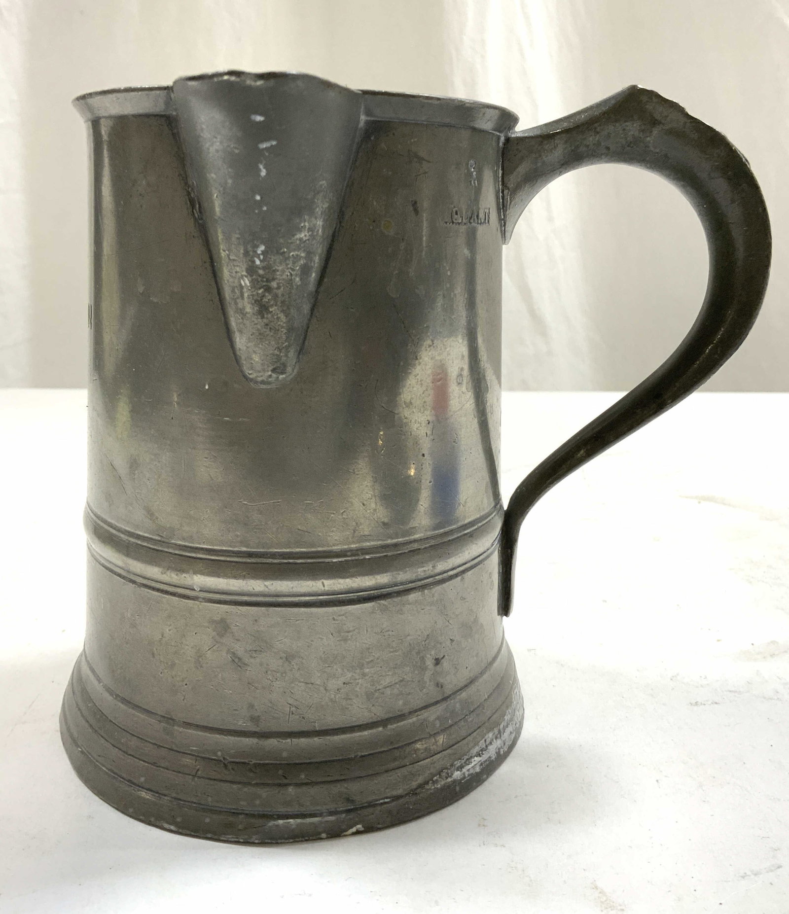 ALMA INN Antique Pewter Tankard: Tankard is monogrammed ALMA INN. Tankard is silver toned pewter. Piece appears to be antique possibly vintage. Tankard measures approximately 6 inches tall 6.5 inches deep 5.5 inches wide. Tankard, pe