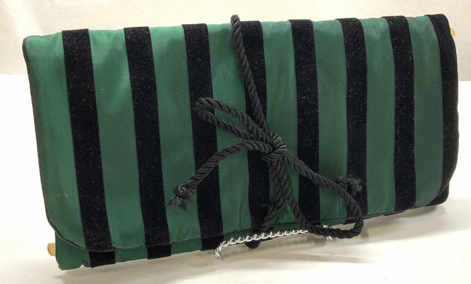 Christian Dior Velvet & Satin Style Travel Case: Emerald green and black striped Christian Dior travel case. Zippered pockets for jewelry, toiletries, make - up, etc. velvet and iridescent satin style. Wrap around rope closure. Closed it measures 9.
