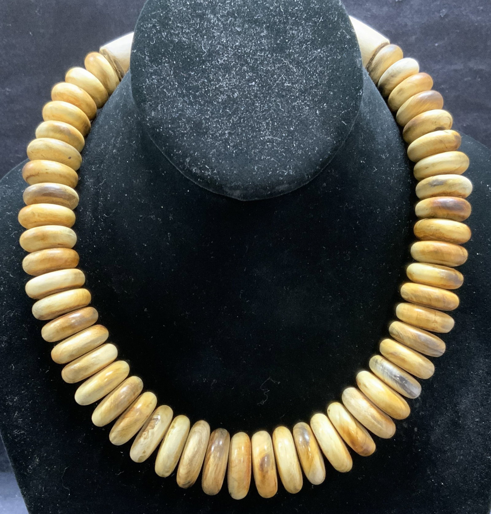 Vintage Carved Horn Beaded Necklace: Vintage carved horn or bone beaded necklace. Round beads with carved hook clasp. Drop length approx. 8 inches. Some surface wear including scratching observed. Estate jewelry, fine jewelry, cocktail j