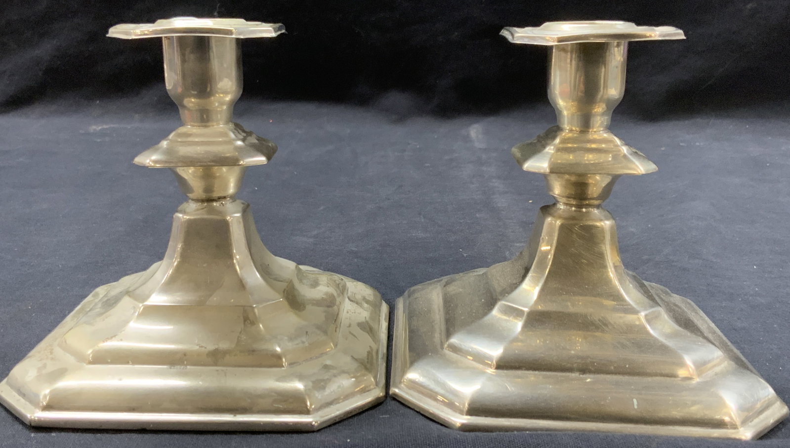 Pr Vtg Stamped 830 Silver Candle Sticks: Pair of vintage, possibly Antique silver candle sticks. Stamped 830 SLc. Weighted. Approx 4.5 inches tall and 4.5 x 4.5 inches basesModerate surface wearing to sterling due to age and use, denting and