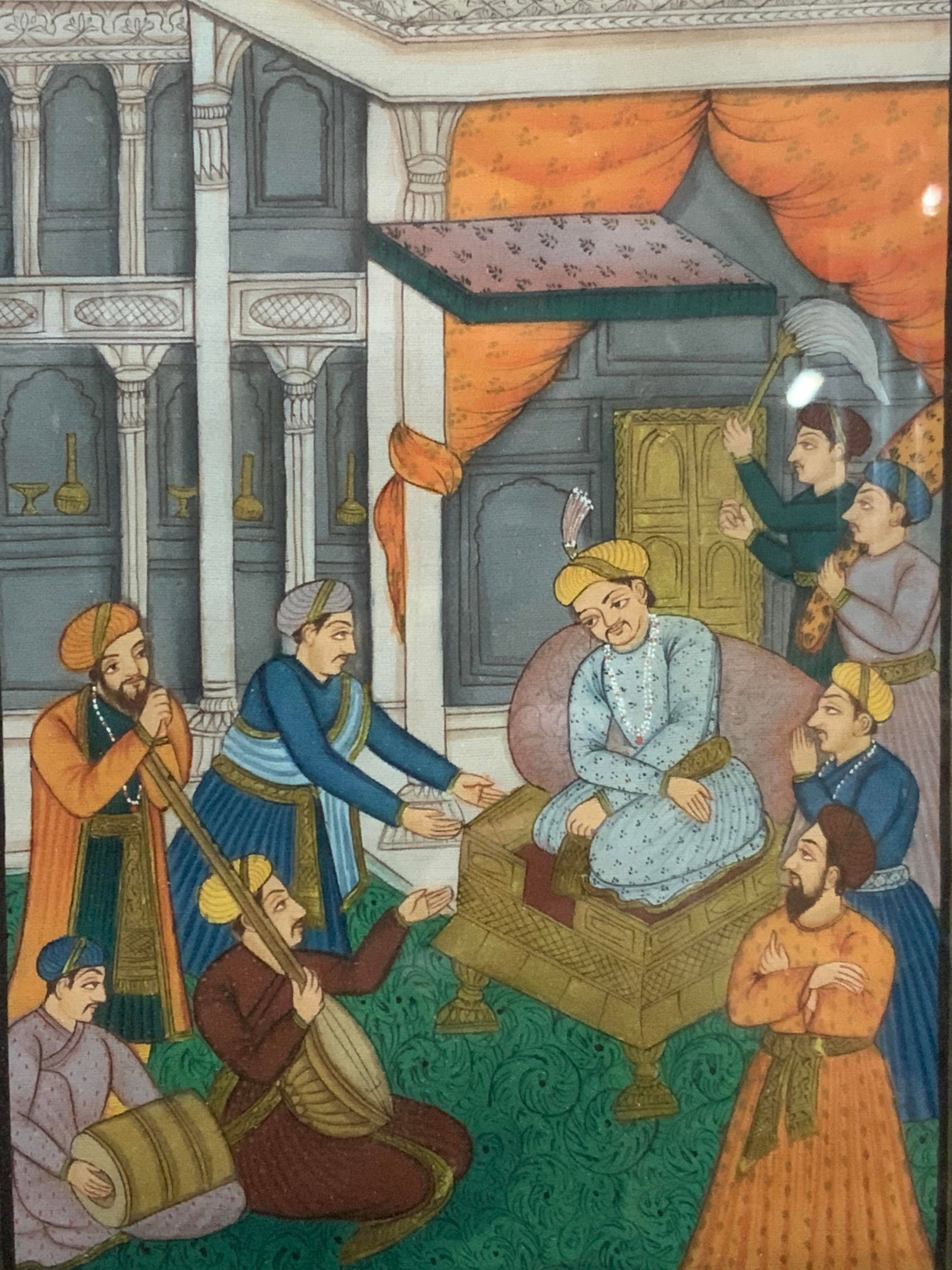Antique Mughal Persian Hand Painting On Silk: Antique Persian Mughal painting on silk, depicting a young royal seated on a chair with musicians playing for him with attendants behind him. Framed in a gold leafed wooden frame with pink mat board. 