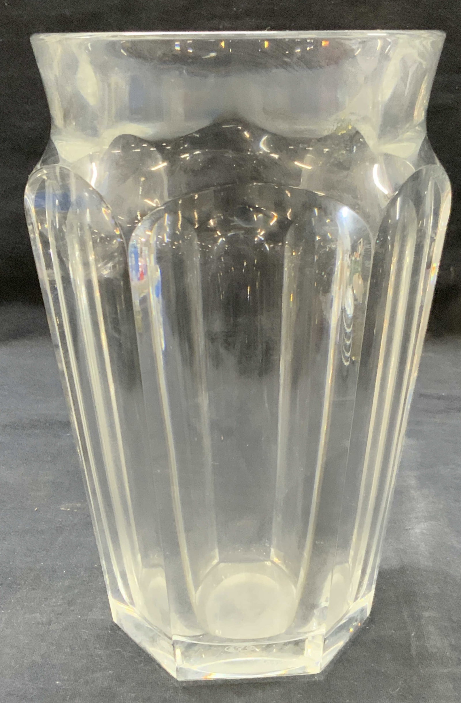 Baccarat Stamped Clear Crystal Vase, France: Stamped baccarat France on underside. Clear crystal vase with arched faceted sides and rounded rim. Approx 8,5 inches tall and 5 inch diameter Moderate surface wearing due to previous use. Baccarat cr