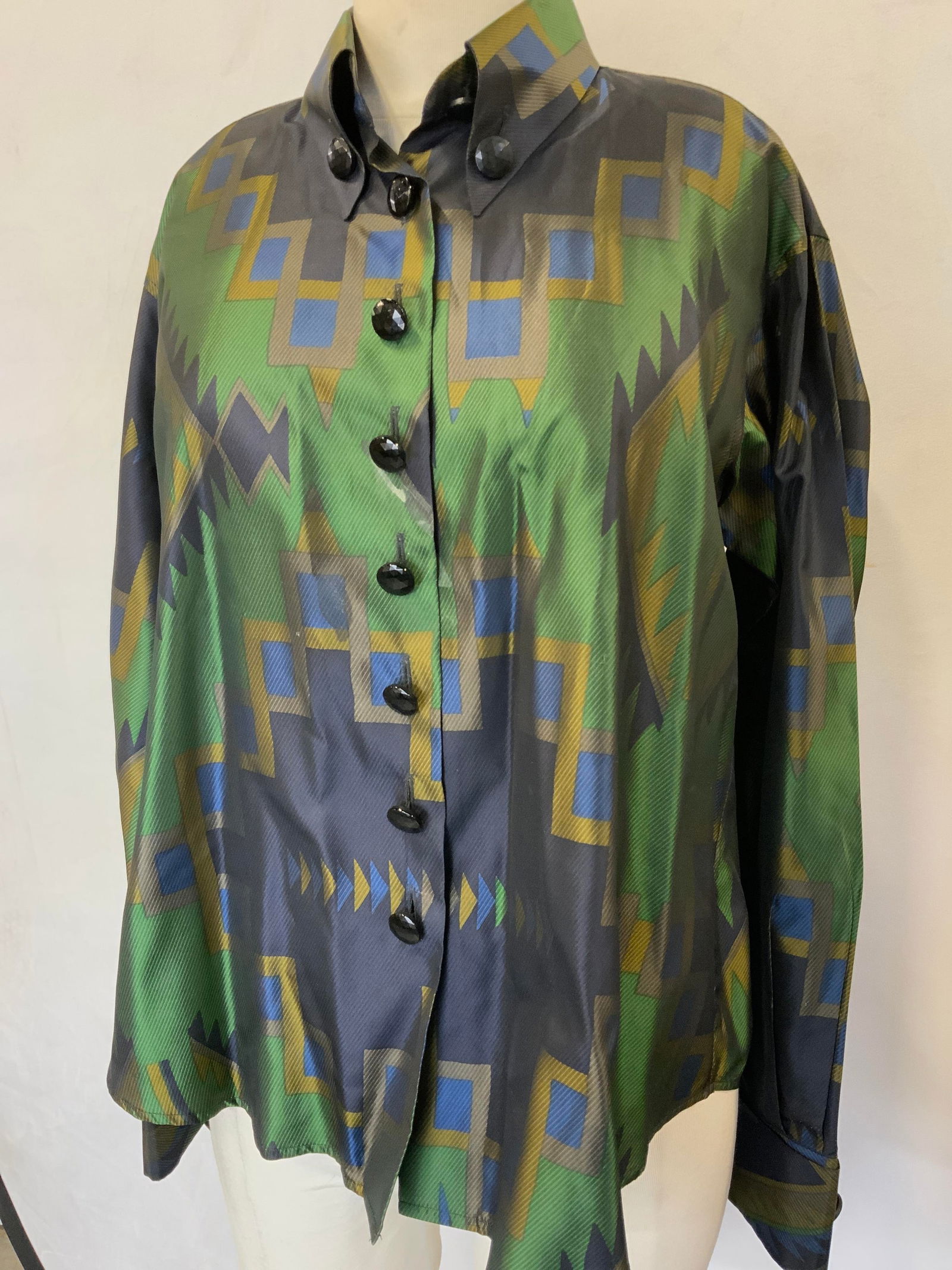 ETRO Silk Native American Pattern Blouse, Italy: ETRO Italy size 44 ladies button down textured silk blouse. Green, navy, black and saffron geometrical southwestern print with faceted buttons . 23 in. Long. Blemish near button., Property of Manhatta