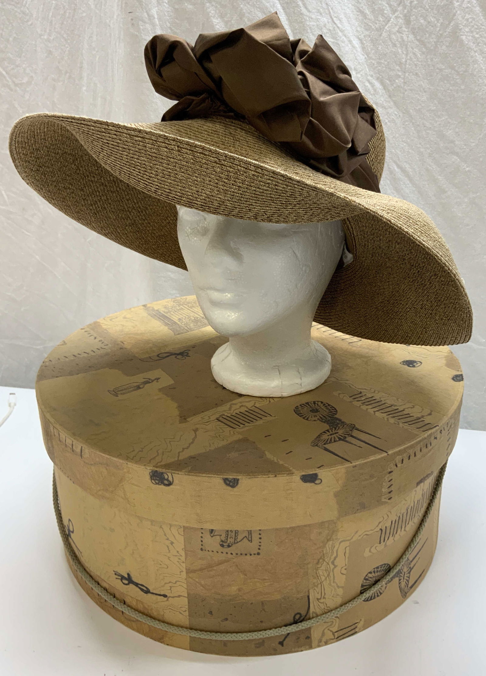 Originals by Teresa Handmade Paper Bonnet, Box: Signed designer Originals by Teresa sun hat/ bonnet. Handmade with paper and made in Italy flexible fabric, flexible brim with a brown silk sash and buttons. Brim width 4.5 in. Head circumference 22.5