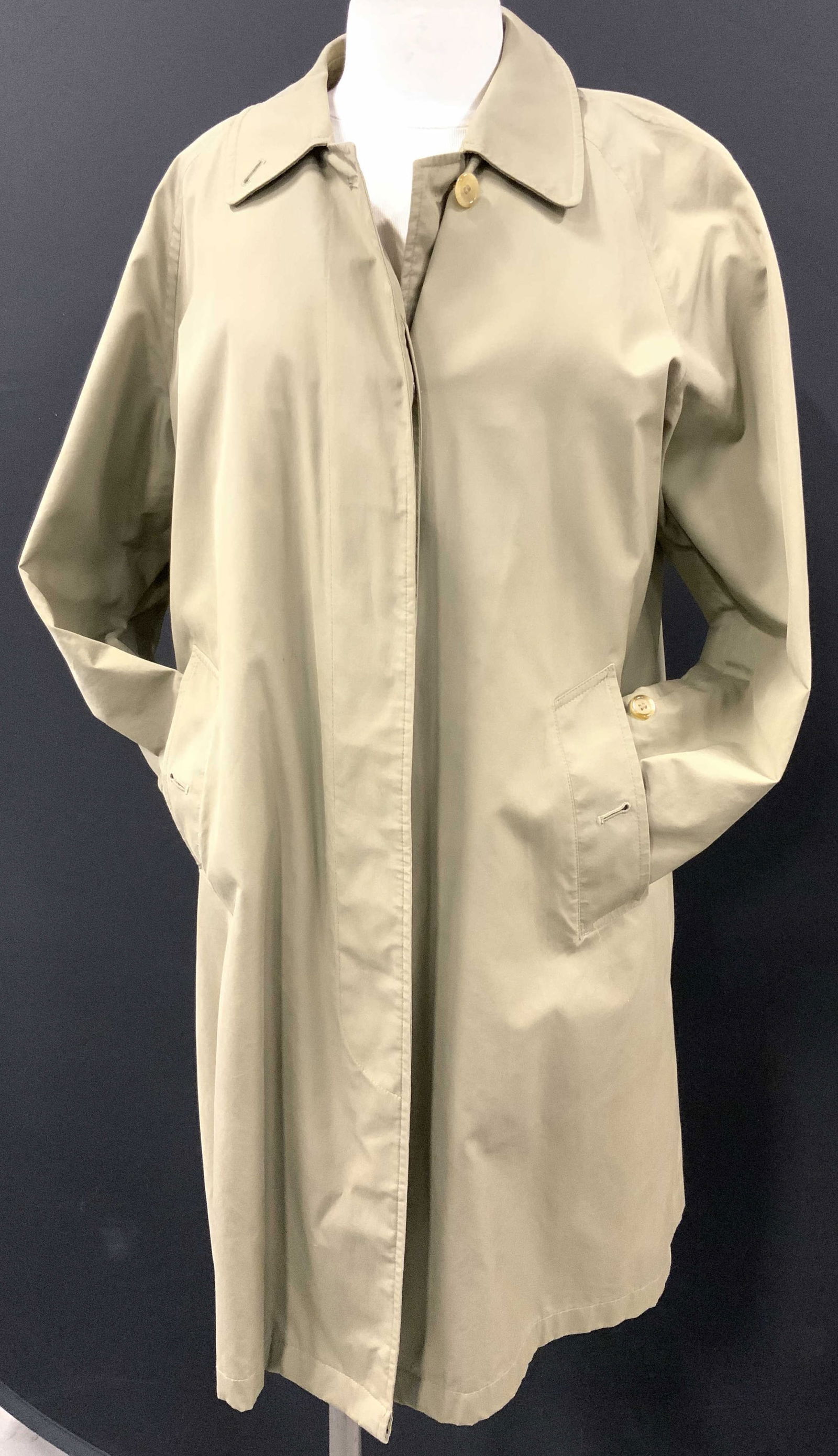 Burberrys Cotton Trench Made for Maruzen, England: Lightweight cotton trench coat in army green., Burberrys , made in England, made especially for Maruzen Tokyo. 36 in. Long. Waist 42 in. General surface wear including blemishes. Ladies cotton trench