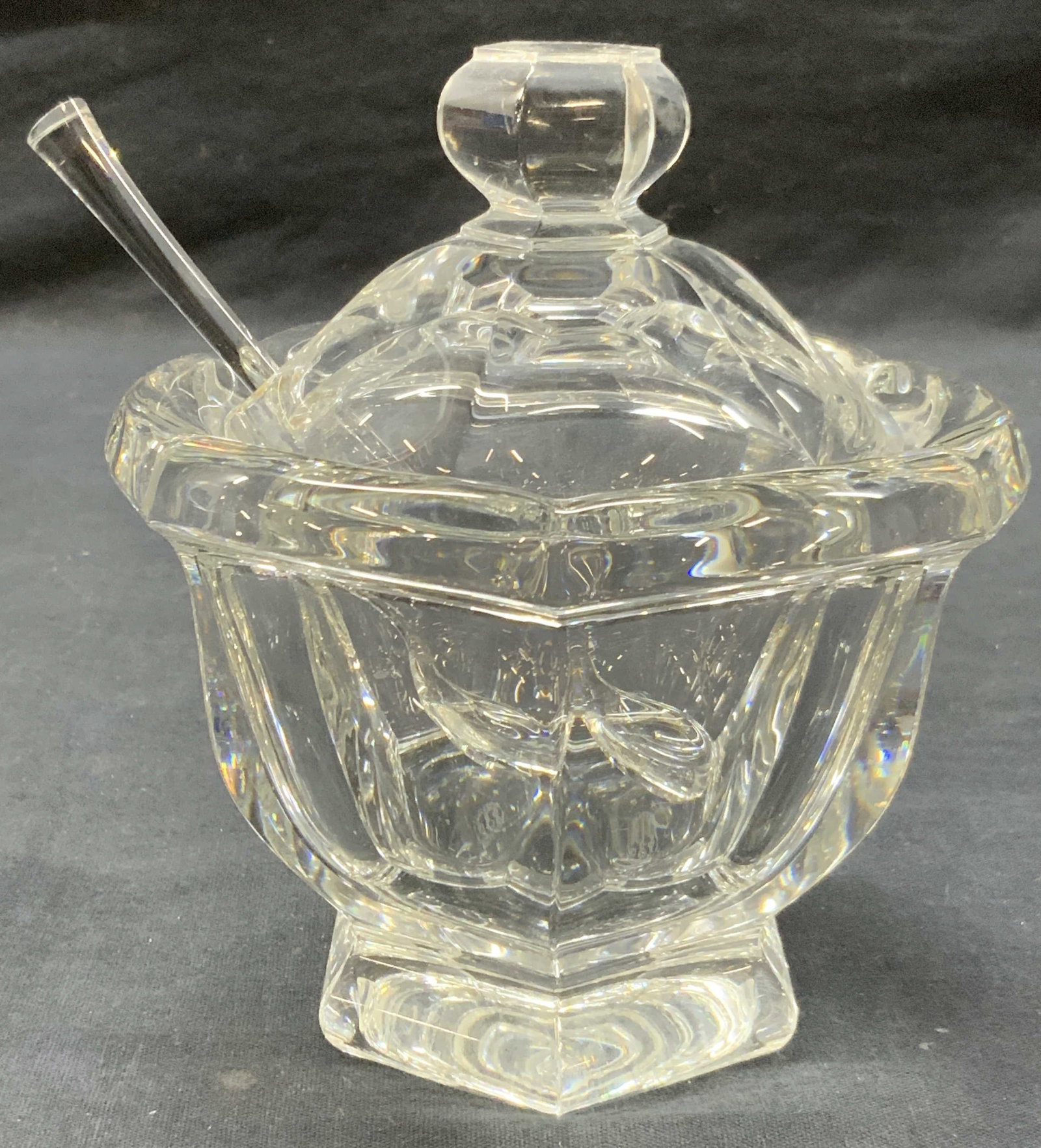 Baccarat Stamped Crystal Sugar Bowl, France: Marked Baccarat France on underside. Solid crystal with crystal spoon. Approx 6 inches tall and 5 inch diameter, spoon is 5.5 inches long. Jam pot, honey pot, mustard jar, sauce / condiment jar. Moder