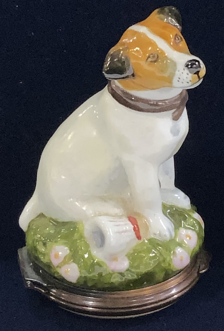 Porcelain & Enamel Jack Russel Pill Box HD England: Hand painted Jack Russel Terrier Pill box. Porcelain dog with enamel hinged opening. Interior is stamped and reads HD England. Measures 2.75 in. Tall x 1 5/8 in. Wide. Decorative arts, Jack Russel Ter