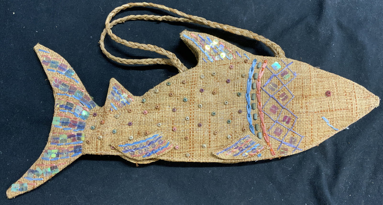 CAPPELLI STRAWORLD Woven Straw Fish Purse: Tag on interior reads CAPPELLI STRAWORLD. Purse is woven straw and has fish form. Piece has multi toned beaded & sequin detail. Measures approximately 15.5 inches long 6 inches tall without handle 10
