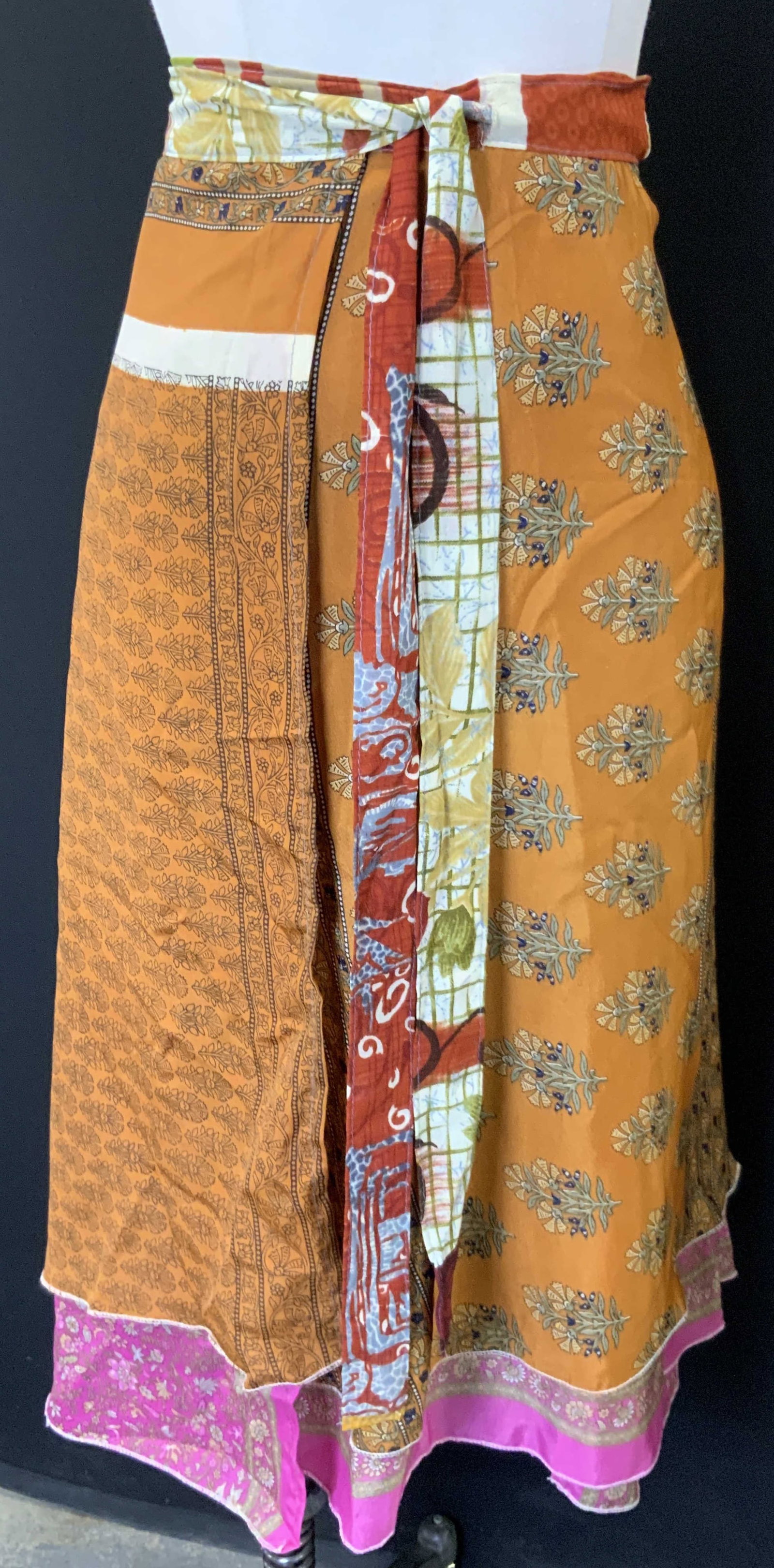 Dori Style Wrap Around Silk Skirt: Wrap around skirt, marked Dori Style, 100% Silk with patch work patterns. Approx 104 inch wrap and 27 inches long. Minor wearing due to previous use. Bohemian style clothing, skirt wrap, skirt, waist 