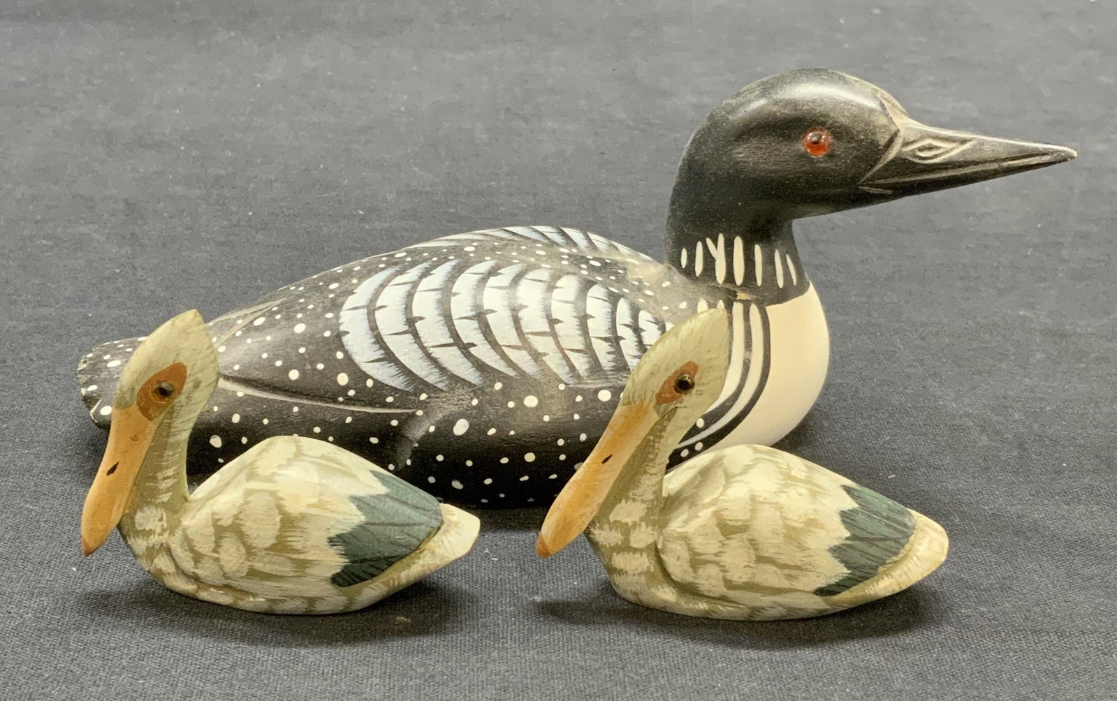 Lot 3 Hand Painted Wood Duck Figurals: Lot of 3 hand painted wooden Duck figurine. Largest marked Adventure Wilderness Collection to underside. Largest measures approx. 6.5 x 2.5 x 2.5 inches. All pieces have some surface wear including sc