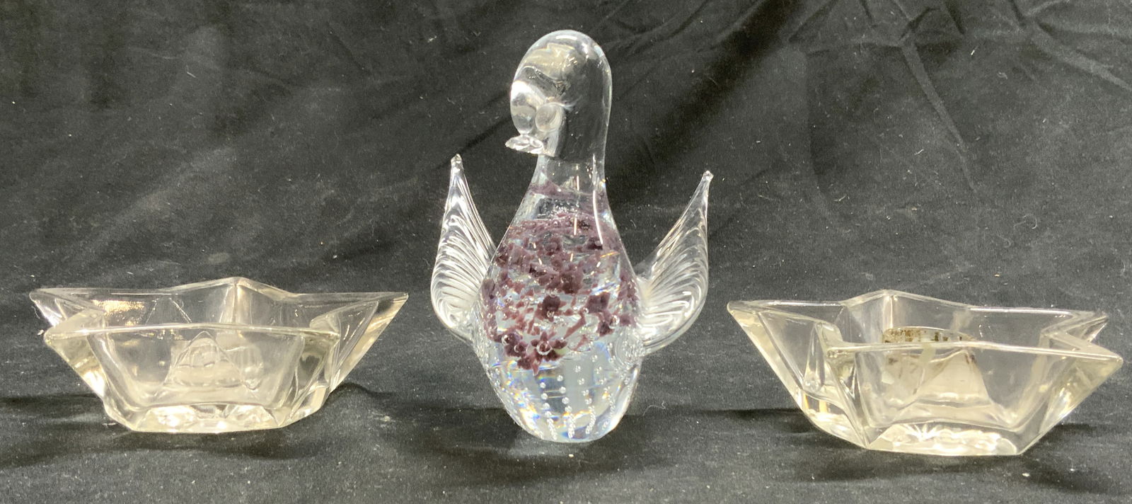 Lot 3 Art Glass Candlesticks & GRANNA GLAS Bird Fig: Figure Lot includes a pair of Star shaped candlesticks, & 1 art glass bird figure. Bird figure has purple toned detail inside tag reads GRANNA GLAS. Bird figure measures approximately 4.5 inches tall