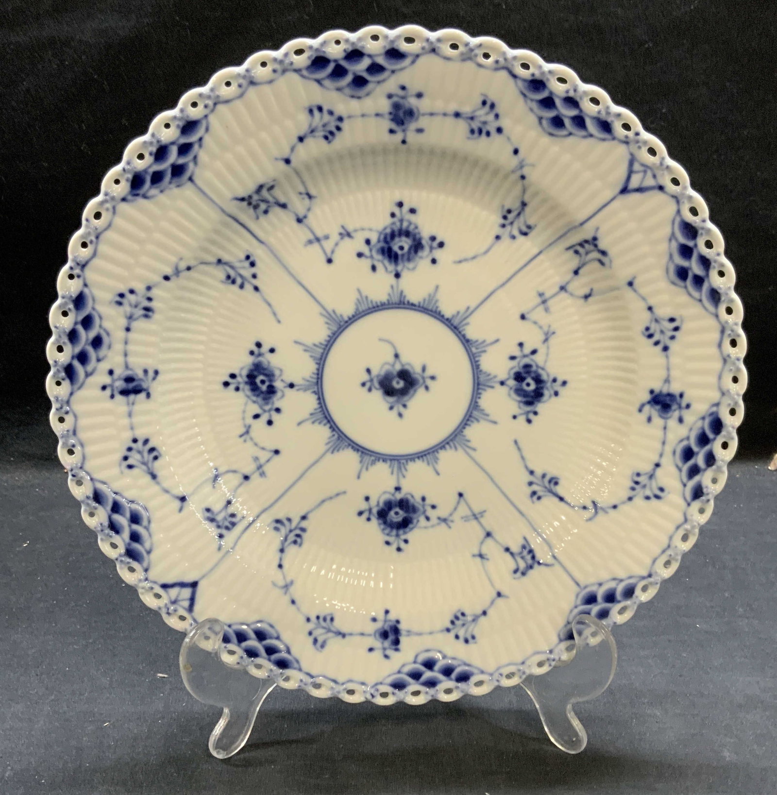 Royal Copenhagen Blue Lace Porcelain Plate: Royal Copenhagen porcelain plate in Blue Lace pattern. Trademarked to underside. Made in Denmark. Measures approx. 10 inches diameter. Piece has weight. Some surface wear including scratching observed