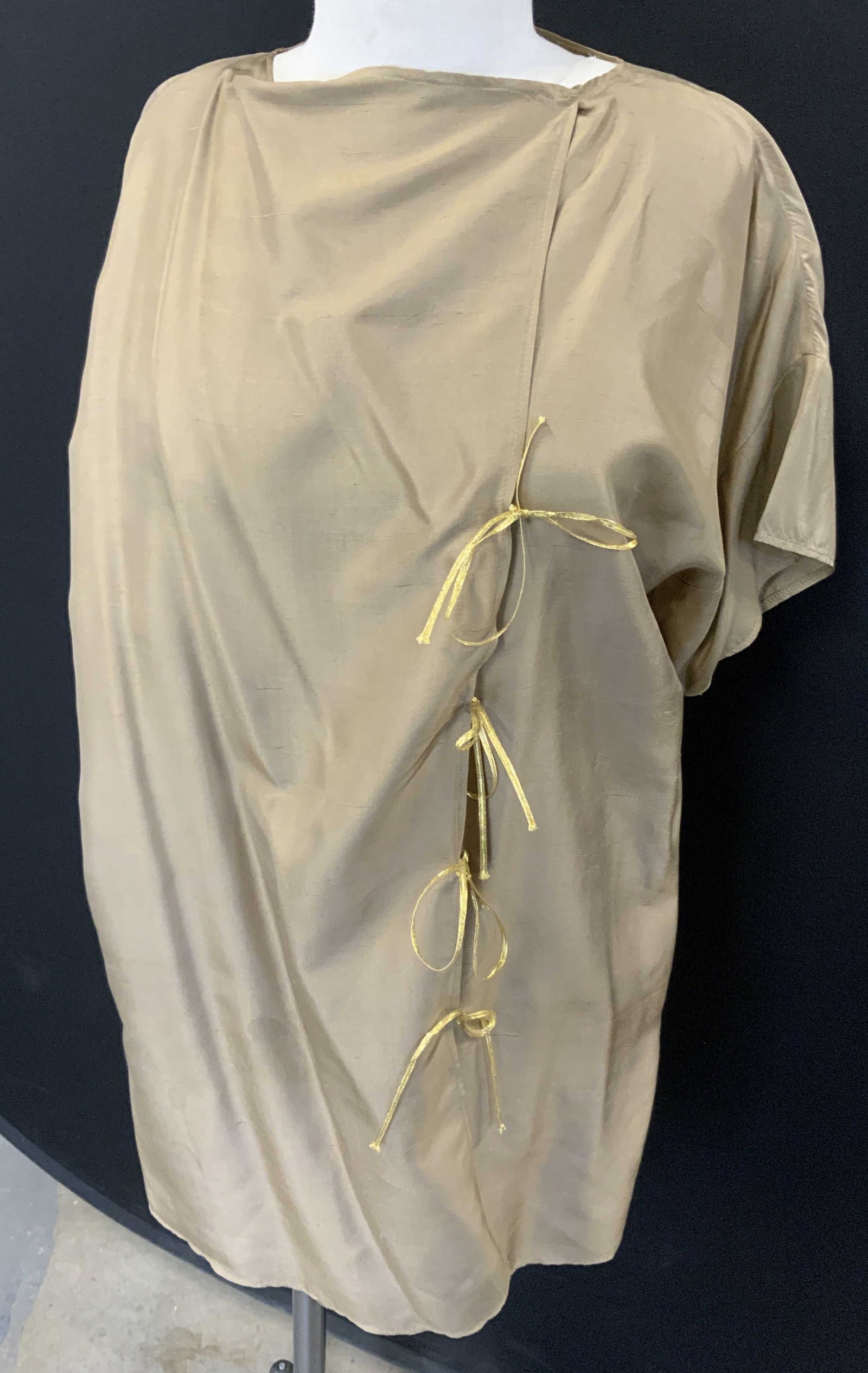 Tan Silk Short Sleeve Blouse with Ties: short sleeve silk blouse in tan. Has blemishing. Plus size. 31.5 in. Long. Has front ties , overlaps and snaps at neck. Interior waist tie, 40in. Waist. Approx., Plus size clothing, Silk Blouse, Fashi