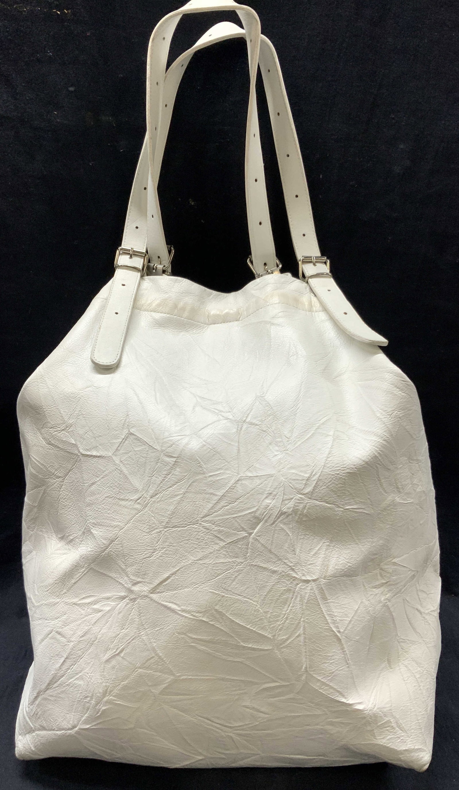 Jane August Leather Tote Bag, Italy: Marked Jane August, genuine leather. White toned leather tote/ all in one bag with top handles. Approx 17 inches tall and 17 inches long and 10 inches wide. Top handles are 10 inches drop. Moderate bl