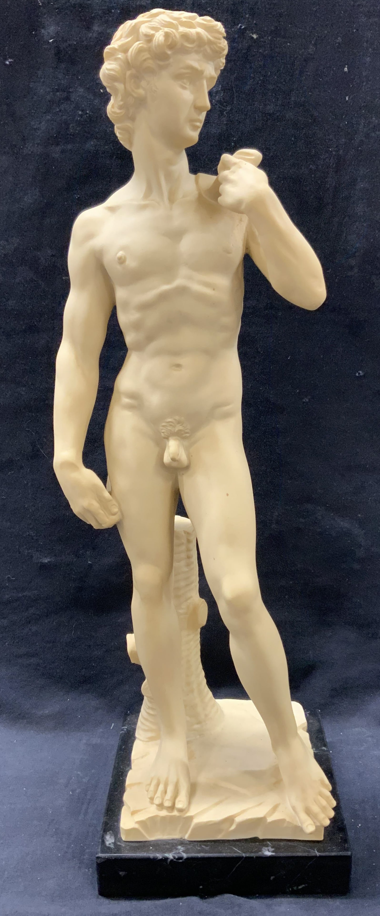 G. Ruggeri Sgn Michelangelo David Sculpture 19.5in: Marked on base G. Ruggeri depicting the Statue of David made of a hard composite and affixed to a stone base. Approx 19.5 inches tall and 6 x 6 inch base. Minor surface wearing to figure Signed figure