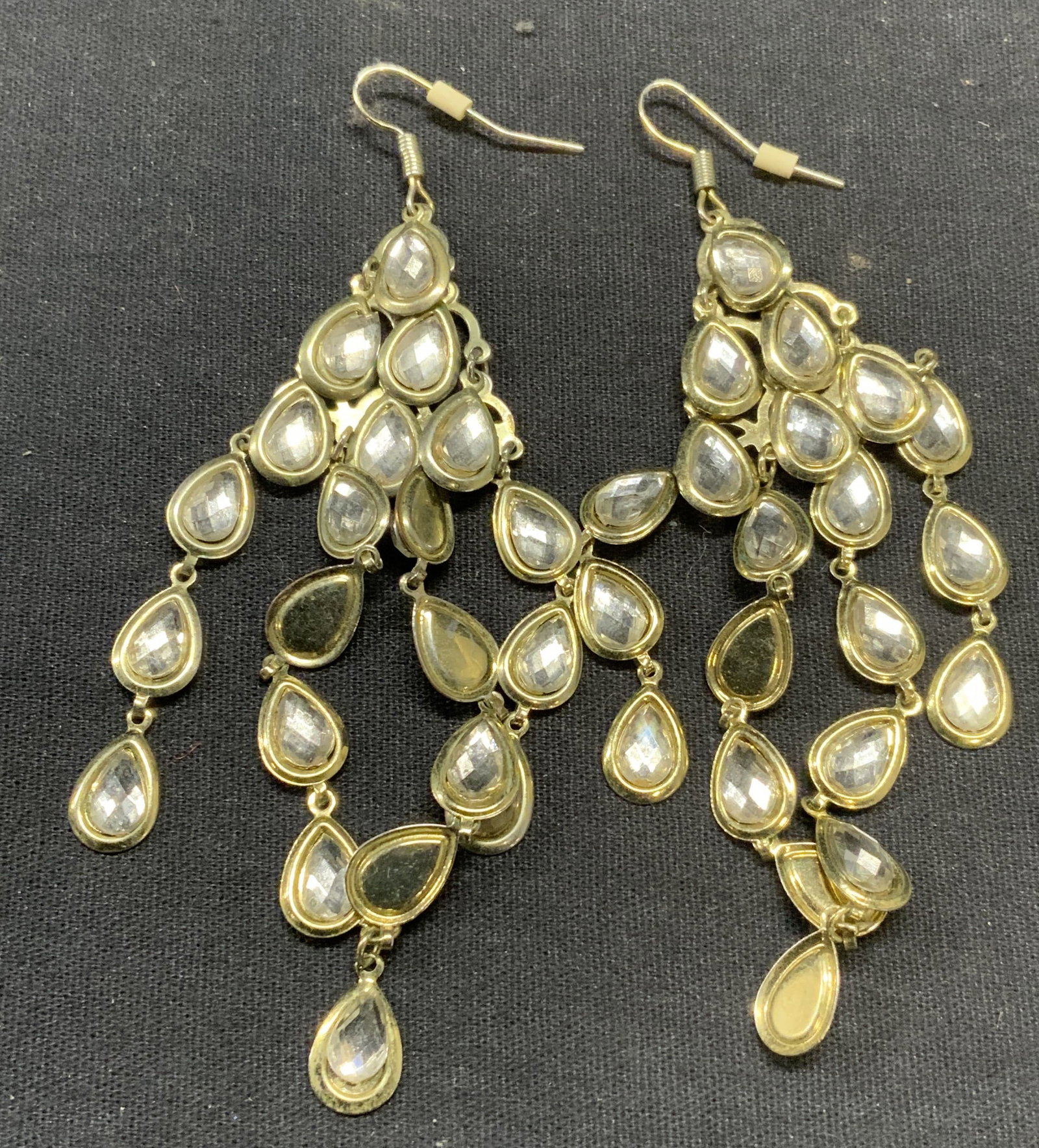 Vintage Gold Tone Crystal Chandelier Earrings: Vintage gold tone and crystal decorated chandelier dangle earrings, hook backing. Measure approx. 3 5/8 inches long. Some surface wear including scratching observed. Estate jewelry, costume jewelry, c