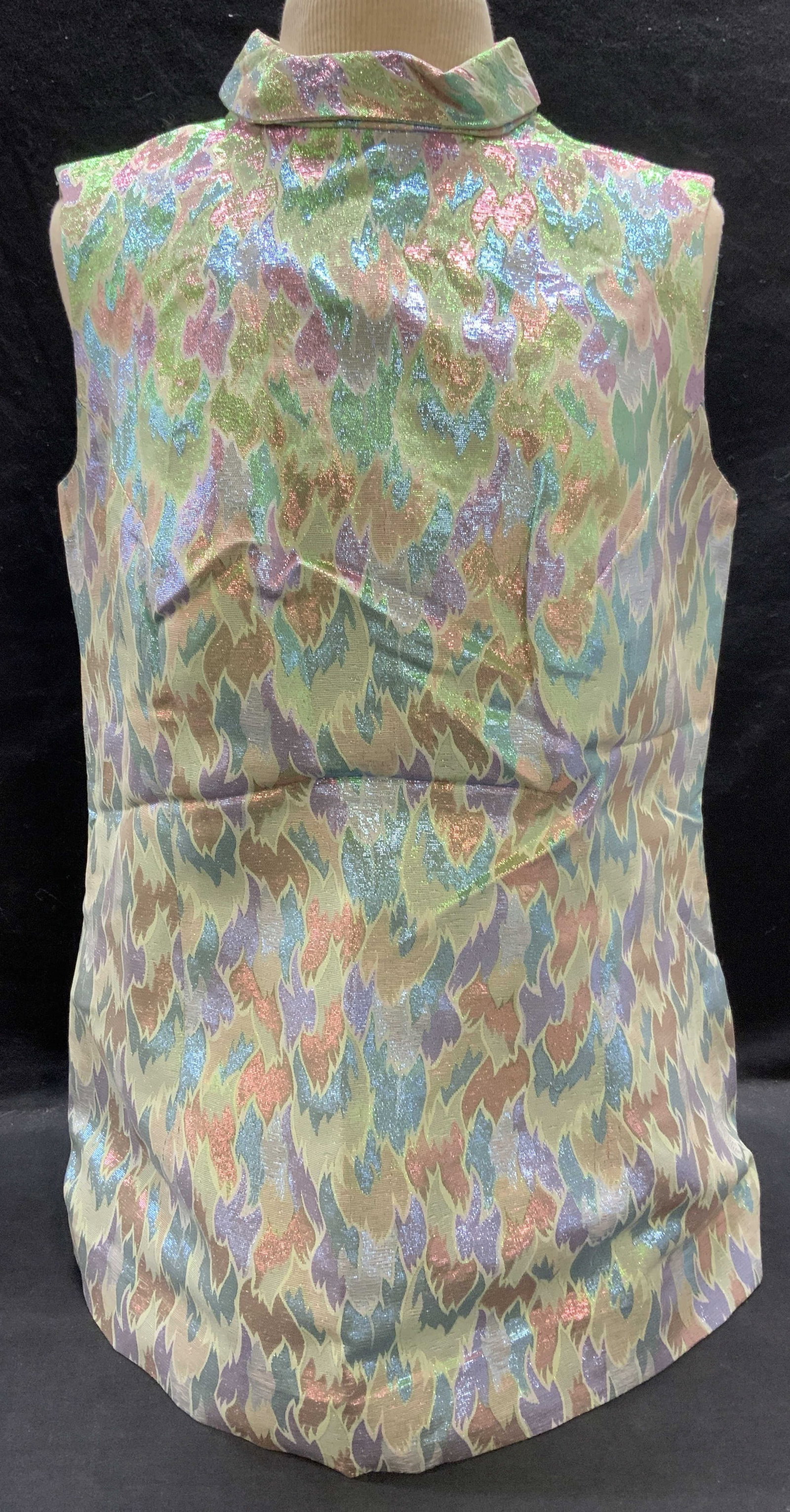 Pastel Metallic Green Sleeveless Top: Pastel toned metallic green and pink sleeveless top. Measures approx. 19 inches across chest. Material feels synthetic. Some wear to material consistent with exposure. Ladies top, ladies pastel top, l