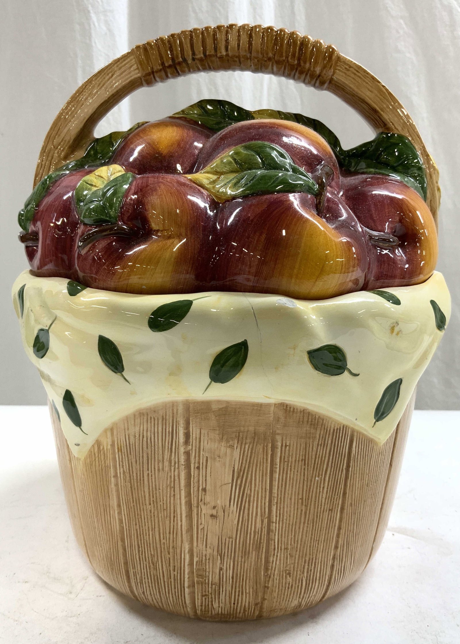 COOKS CLUB Porcelain Basket Vessel W Lid: Underside is marked COOKS CLUB. Vessel is porcelain. Piece has fruit basket form. Vessel is lidded with arched handle. Piece measures approximately 10 inches tall 8 inches wide. Vessel, basket, cooks 