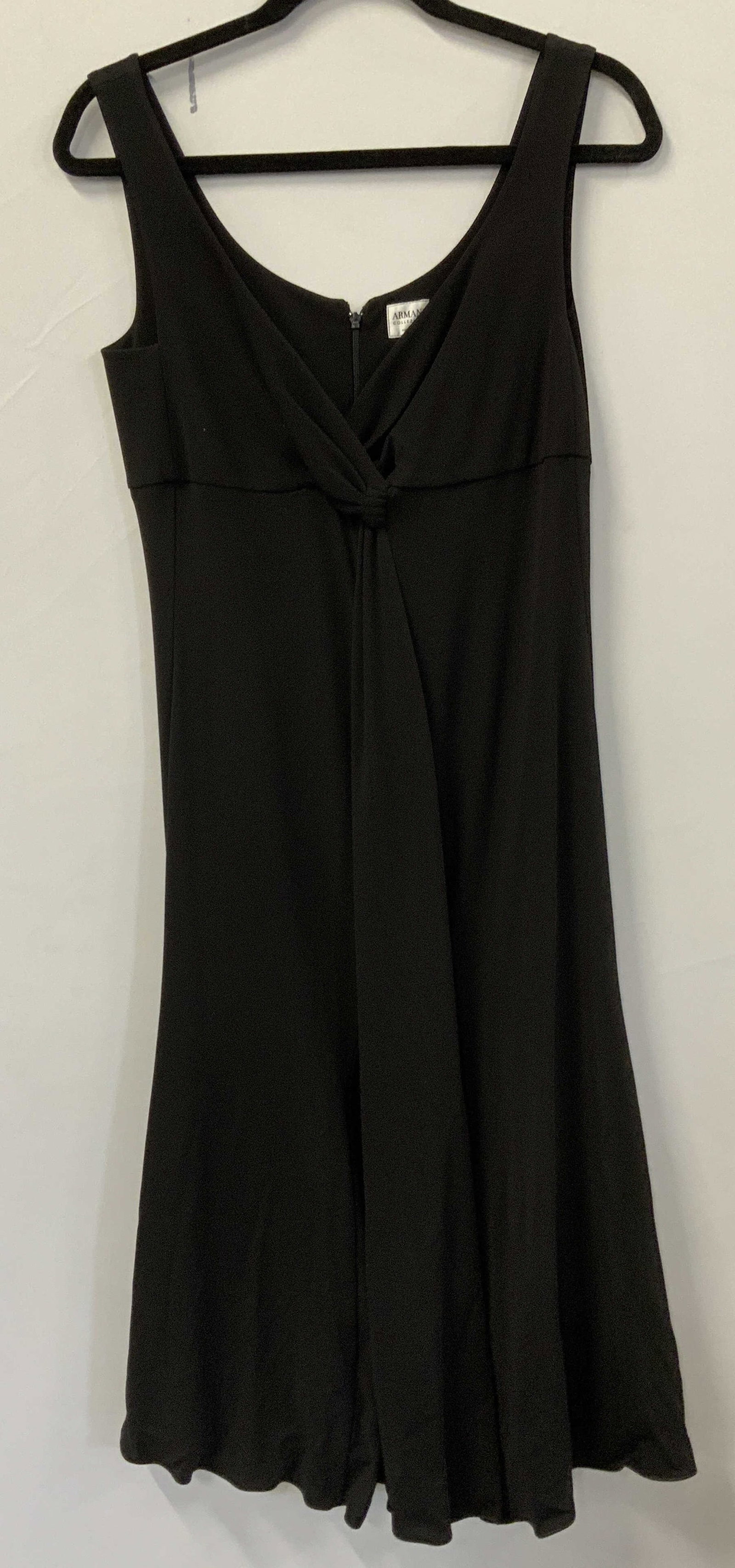 Armani Black Sleeveless Maxi Dress, Italy: Armani black sleeveless maxi dress. Twist front detail. Made in Italy. Measures approx. 14 inches across chest. Material unknown. Some wear to material consistent with exposure. Armani, Armani dress, 