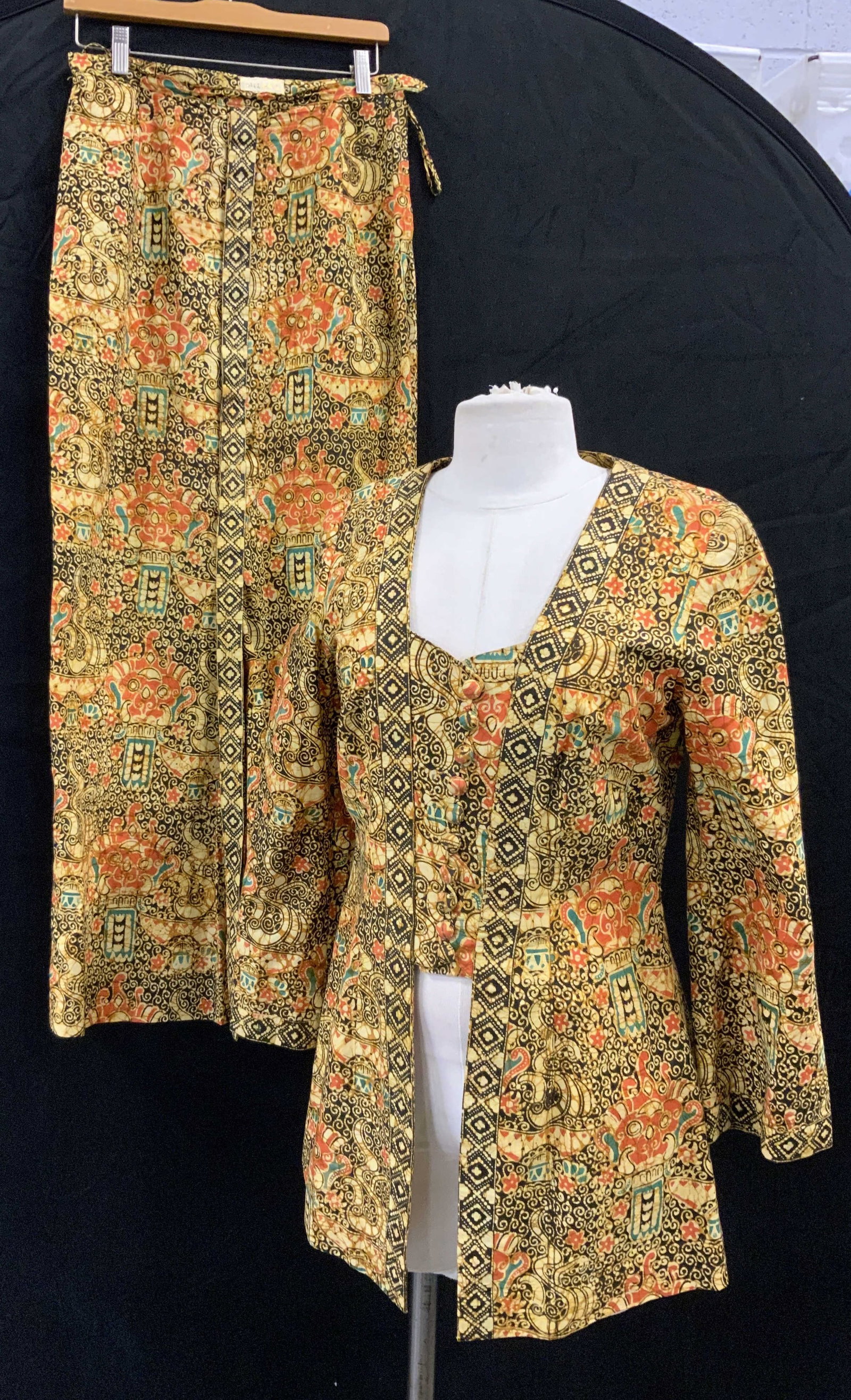 2 Piece Asian Batik Skirt & Top, Hildas Originals: Hand made clothing , designer Hildas Originals cotton batik matching skirt and shirt. East Asian mask face with lei-wen thinker clause scrolling . Colors of black, coral, gold, and yellow. skirt has a