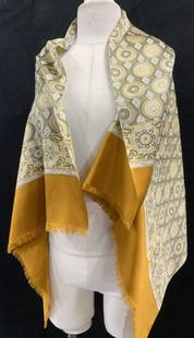 Mary McFadden Reversible Shawl & Silk Shawl: Metallic reversible shawl, one side gold the other side silver, labeled Mary McFadden, 19.5 x 71 in. Has blemishes on gold side. Silk shawl with fringe, 27 x 48 in. Reticulated medallion and diamond p