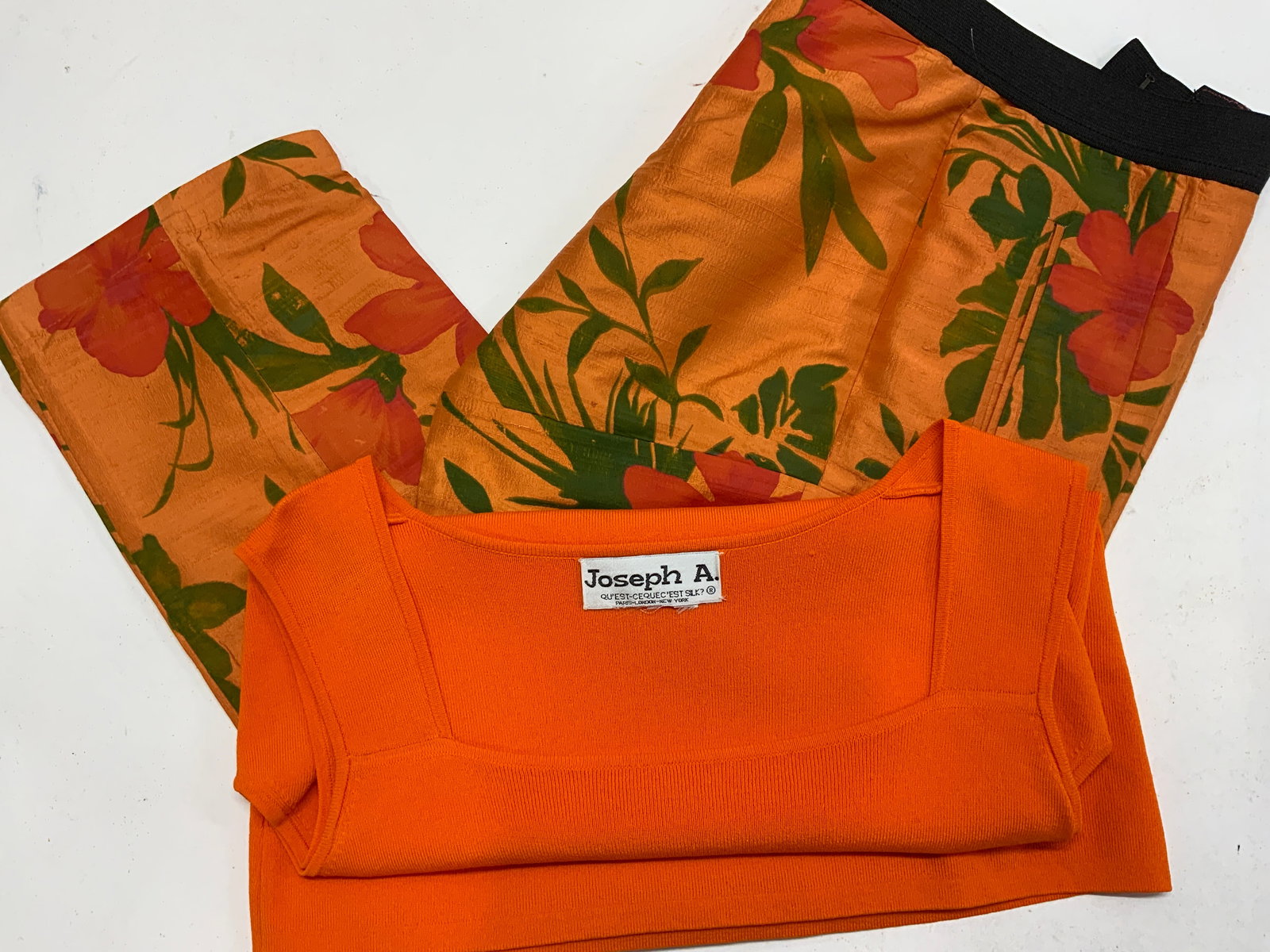 Jospeh A. Knit Sweater, Painted Tropical Silk Pant: 2 items. Orange knit tank sweater by Joseph A. Size Medium., tropical botanical pants with stretch band waist, size 12..no designer label, no fabric label. These are fully lined. Thought to be silk an