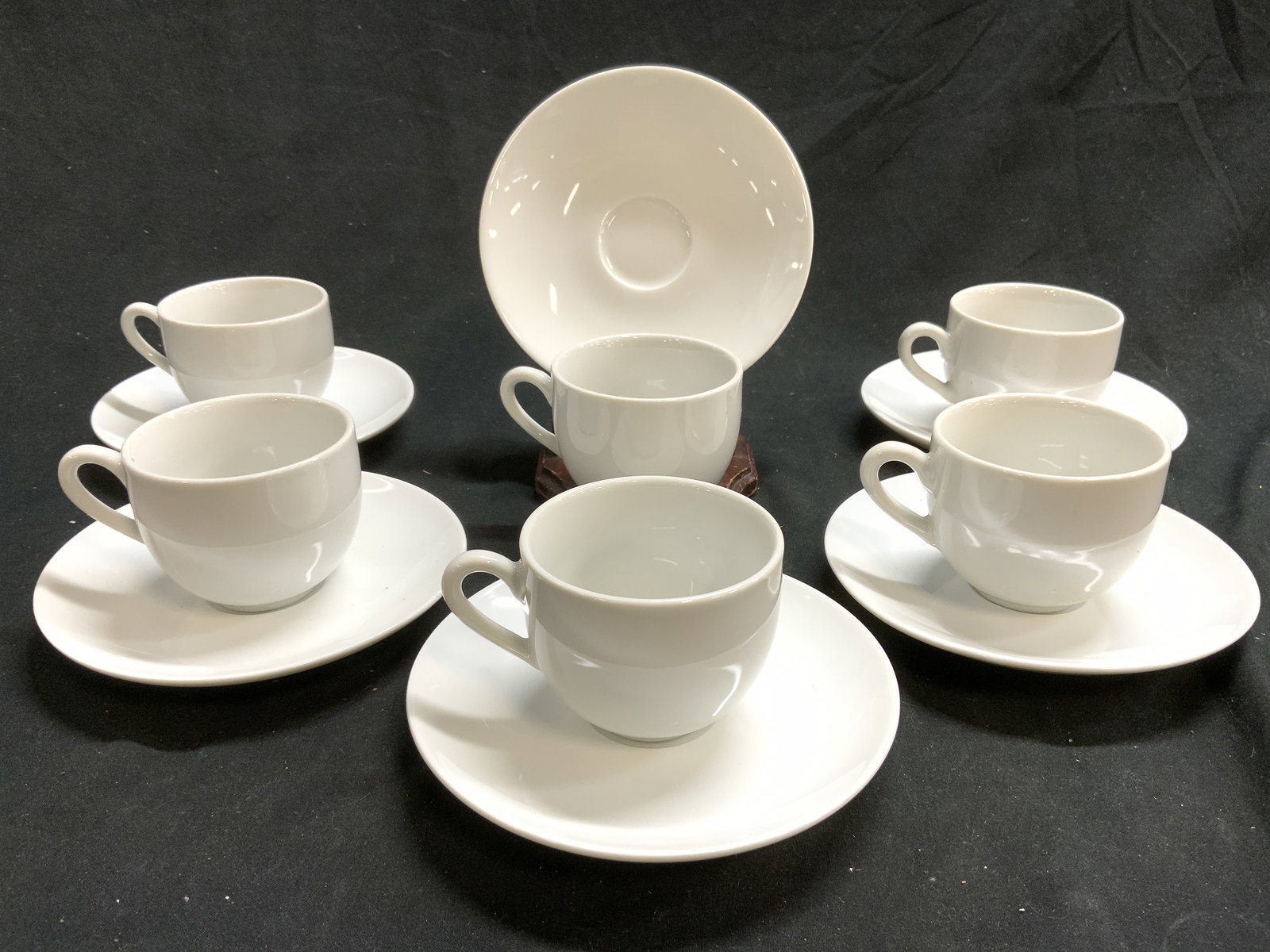 ROYAL NORFOLK Set 12 Porc Teacup & Saucers W Bx: Undersides each have crown Trademark & reads ROYAL NORFOLK FINE PORCELAIN. Lot includes 6 teacups & 6 saucers. Each are white toned and porcelain. Lot includes original box. Saucers each measure appro