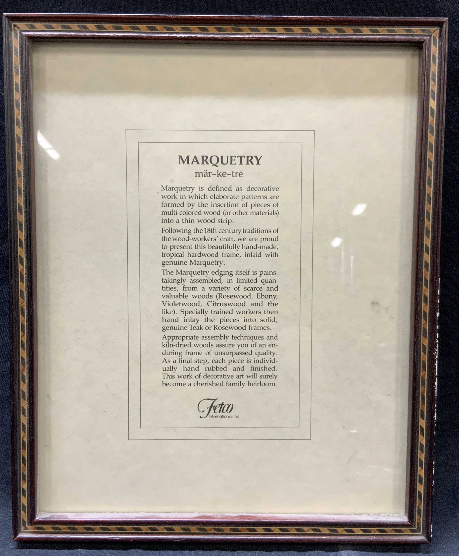 Fetco International Marquetry Wooden Frame: Fetco international Inc. wooden picture frame with marquetry inlayed on outer edges in the red toned wooden frame. Approx 10.75 x 8.75 inches. Window measures 9.75 x 8.75 inches Moderate wearing to si