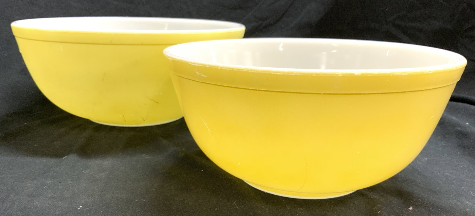 PYREX Lot 2 Glass Serv Bowls Vessels Yellow USA: Undersides each read PYREX MADE IN USA. Each bowl is yellow with white exteriors & undersides. Each bowl has lip. Largest bowl measures approximately 10.5 inches wide 4.5 inches tall. Pyrex, Pyrex bow