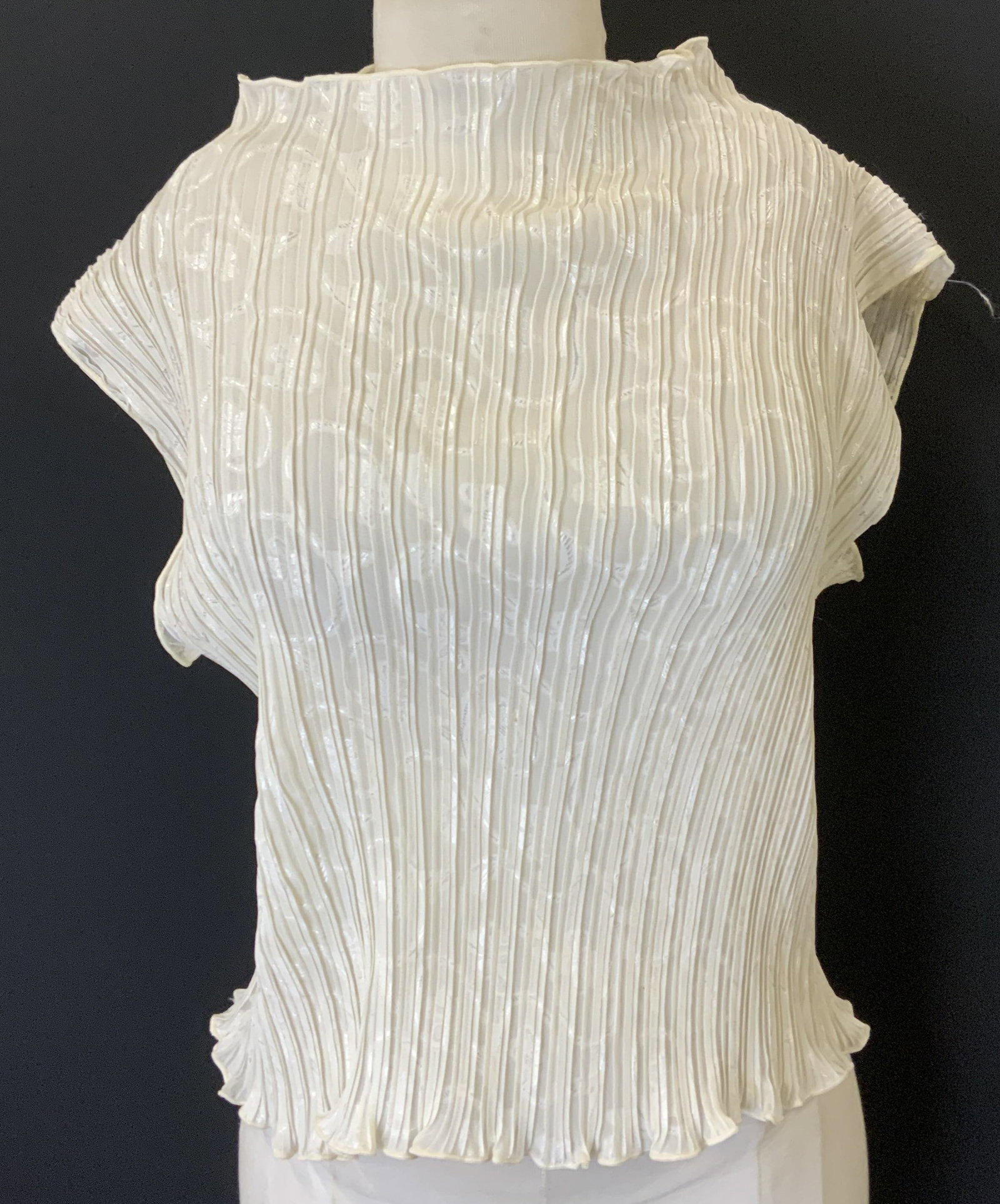 Talk of the Walk Sleeveless White Pleated Top: Talk of the Walk white sleeveless pleated top. Measures approx. 16.5 inches across chest. 100% polyester. Some blemishes observed. Talk of the walk, talk of the walk top, ladies designer top, ladies d