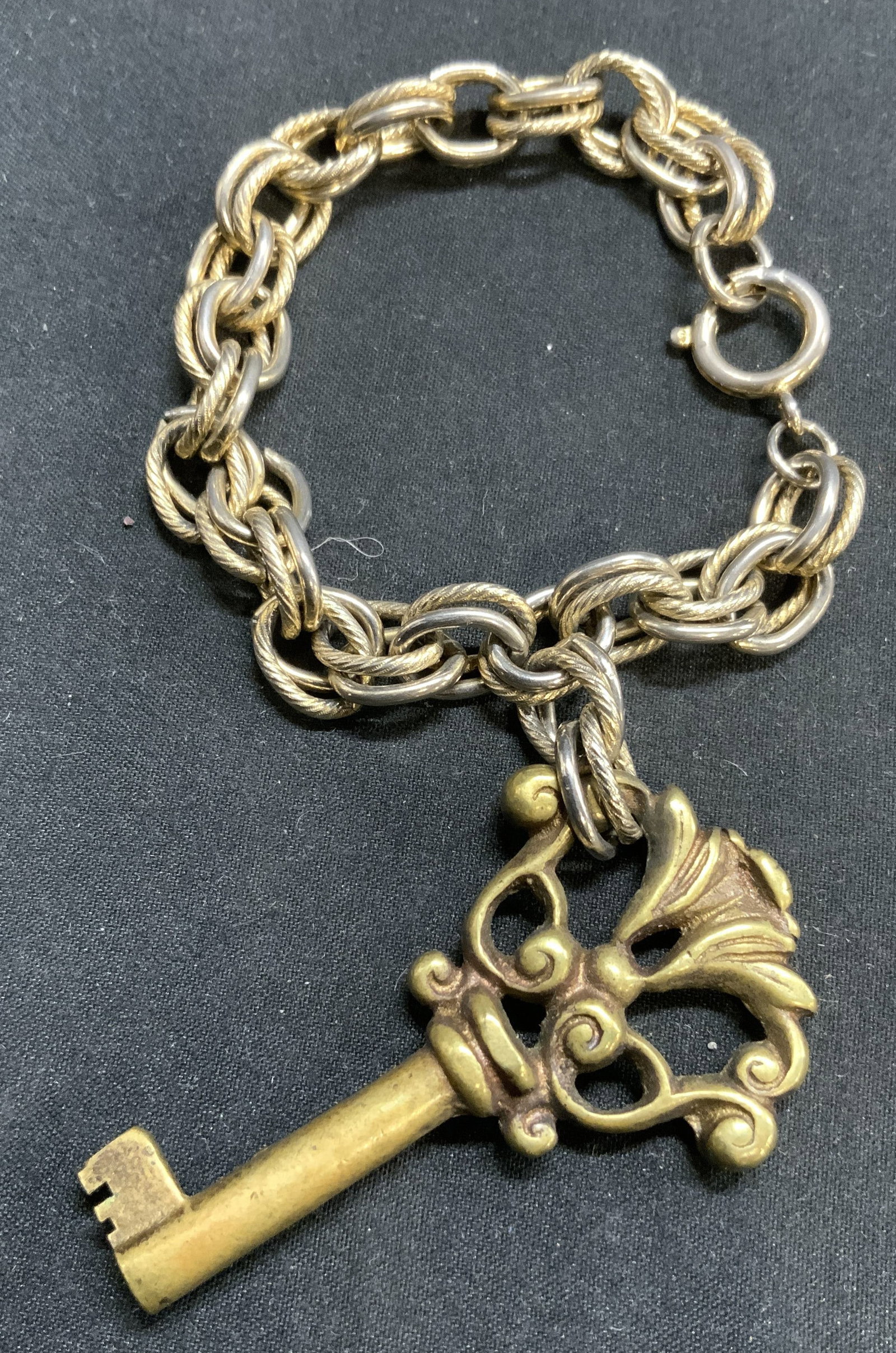 Chain Link Bracelet W Gilt Metal Key & Box GERMANY: Clasp inscribed Germany. Box interior reads TRESS VALLEY STREAM. Bracelet has white metal double chain link. Piece has gilt metal key, possibly gilt bronze, possibly brass. Key has ornate detailing. L