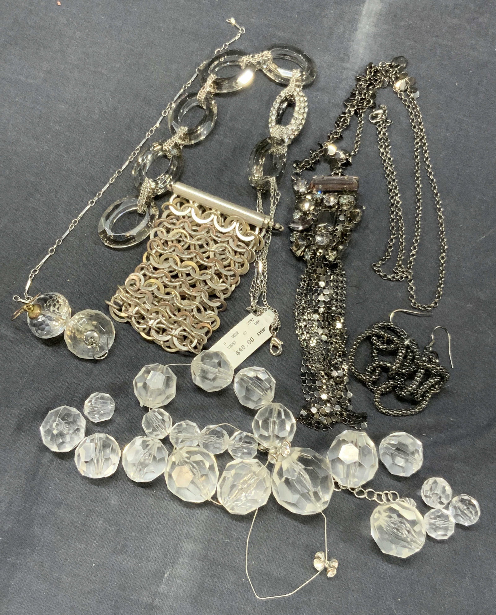 Lot 6 Kenneth Cole & Nena Crystal Jewelry & More: Lot of 6 pieces of jewelry, 1 nena crystal necklace, as is, with faceted crystals in varying sizes. 1 chain bracelet marked Kenneth Cole, 2 faceted crystal earrings, at 1.5 inches long. 1 pair of blac