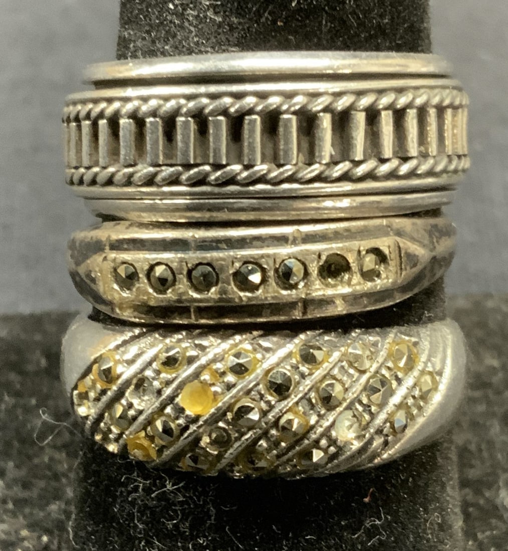 Lot 3 Sterling Silver Marcasite Rings, More: Lot of 3 sterling silver rings. 2 rings with marcasite decoration, 1 ring with embossed band. All pieces marked sterling or 925. Total weight of all pieces .25 ozt. Largest ring size 8.75, smallest 7.