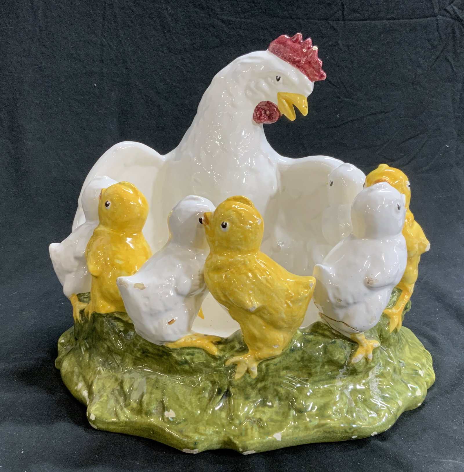 Chicks & Hen Handmade Porcelain Centerpiece Bowl: Large hand crafted bowl with mother hen and her chicks. 13.5 in. Wide, approx 11 in. Ht. No marks. Yellow and white chicks in circle walking on grass. vintage piece. There are paint and porcelain chip