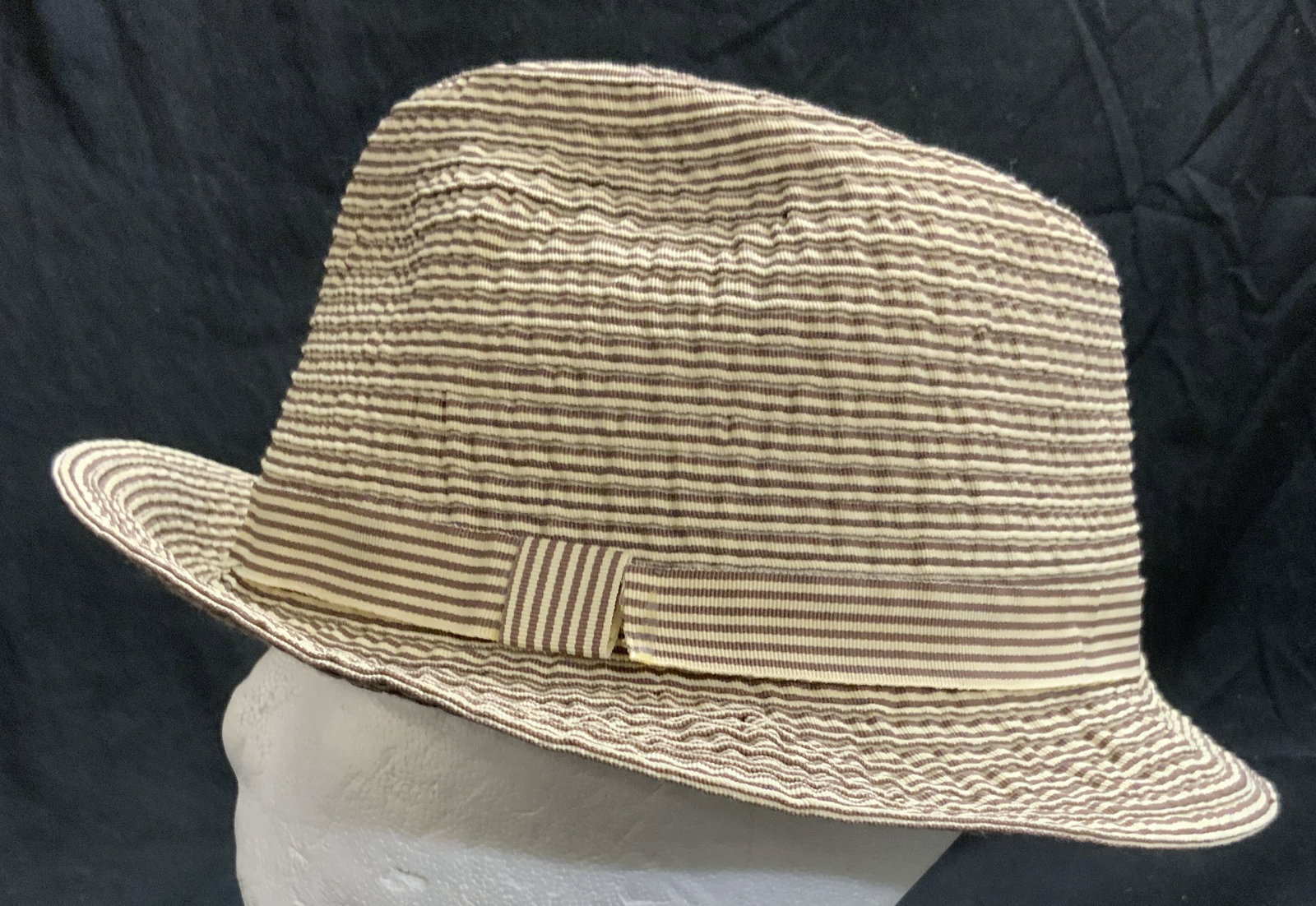 JOHN CALLANAN LEGACY Poly Fedora Sz L: Tag reads JOHN CALLANAN LEGACY JIHAT CENTER NEW YORK NY. Fedora is polyester size large. Piece has brown & cream striped detail. Hat measures approx 9.5 inches wide 10 inches deep 4.5 inches tall. Hat