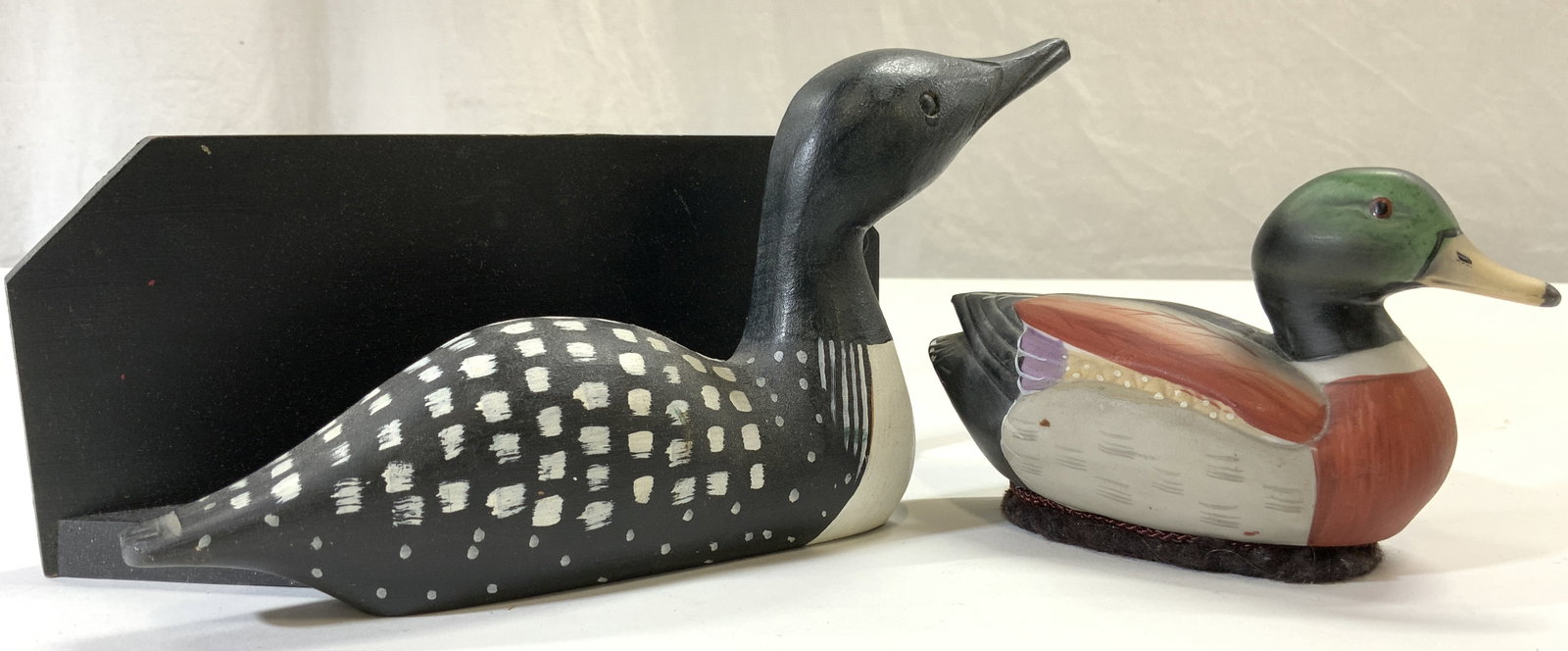 JASCO Lot 2 Porc Duck & Signed Carved Wood Duck: Lot includes 1 duck figure signed illegibly on underside, and 1 duck figure tag reads JASCO. Signed duck figure is wooden, possibly hand crafted, black and white toned. JASCO trademarked duck figure i